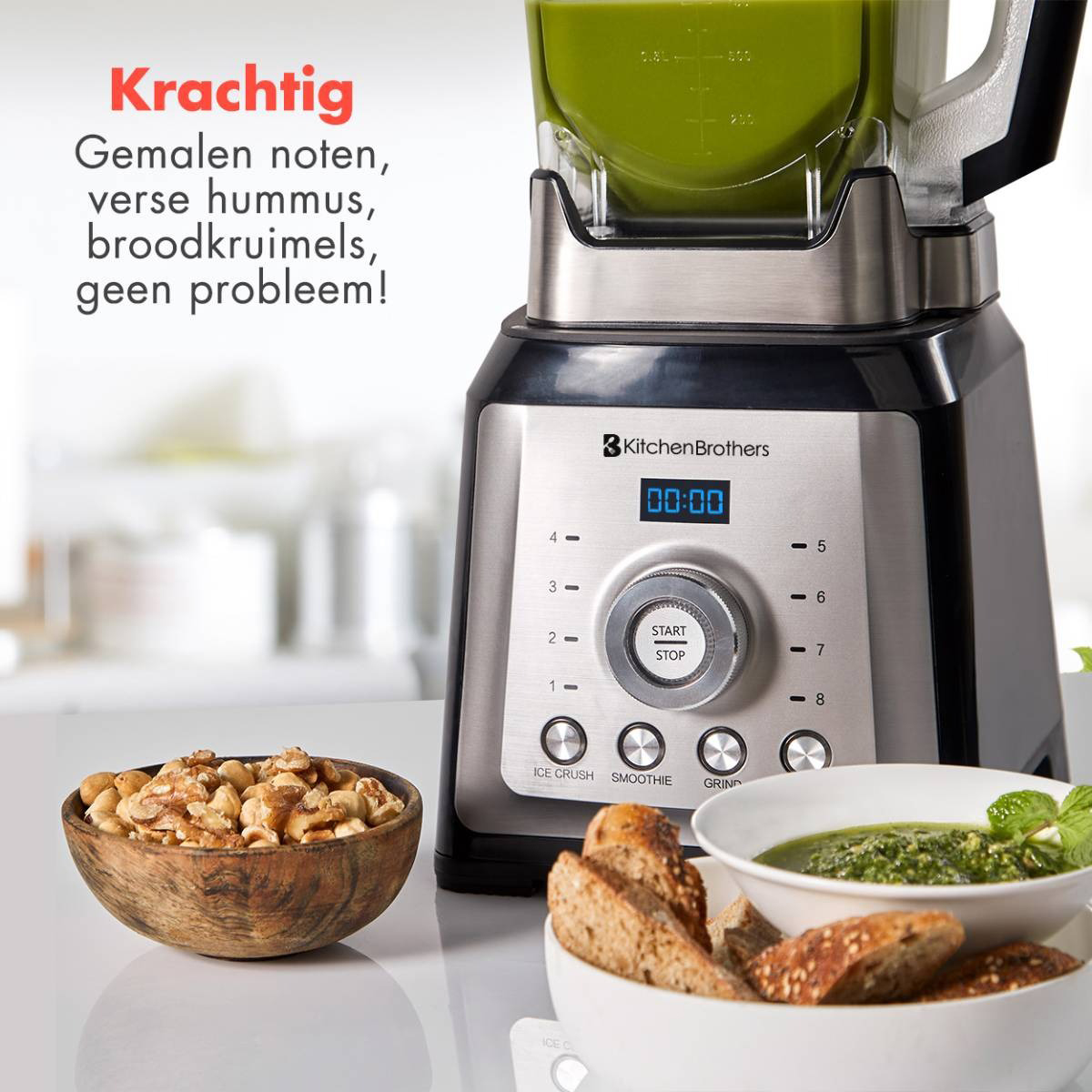 Blender with ingredients and prepared food. Bowl of nuts, bread, and pesto. The word Krachtig.