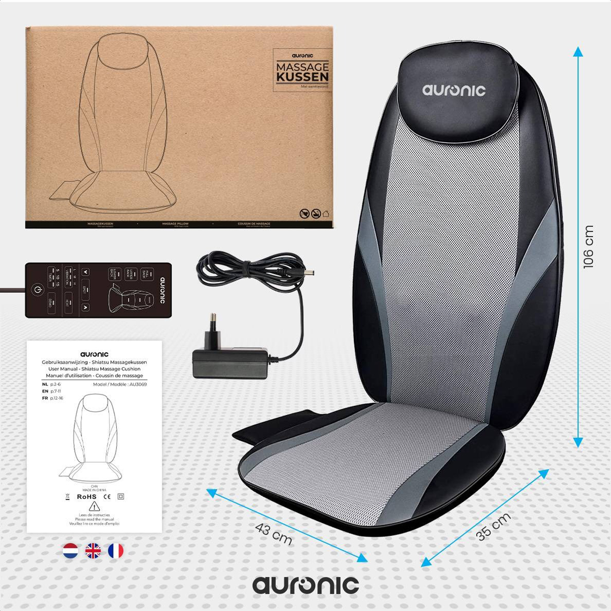 A massage seat with packaging. Included is a control panel and power supply.