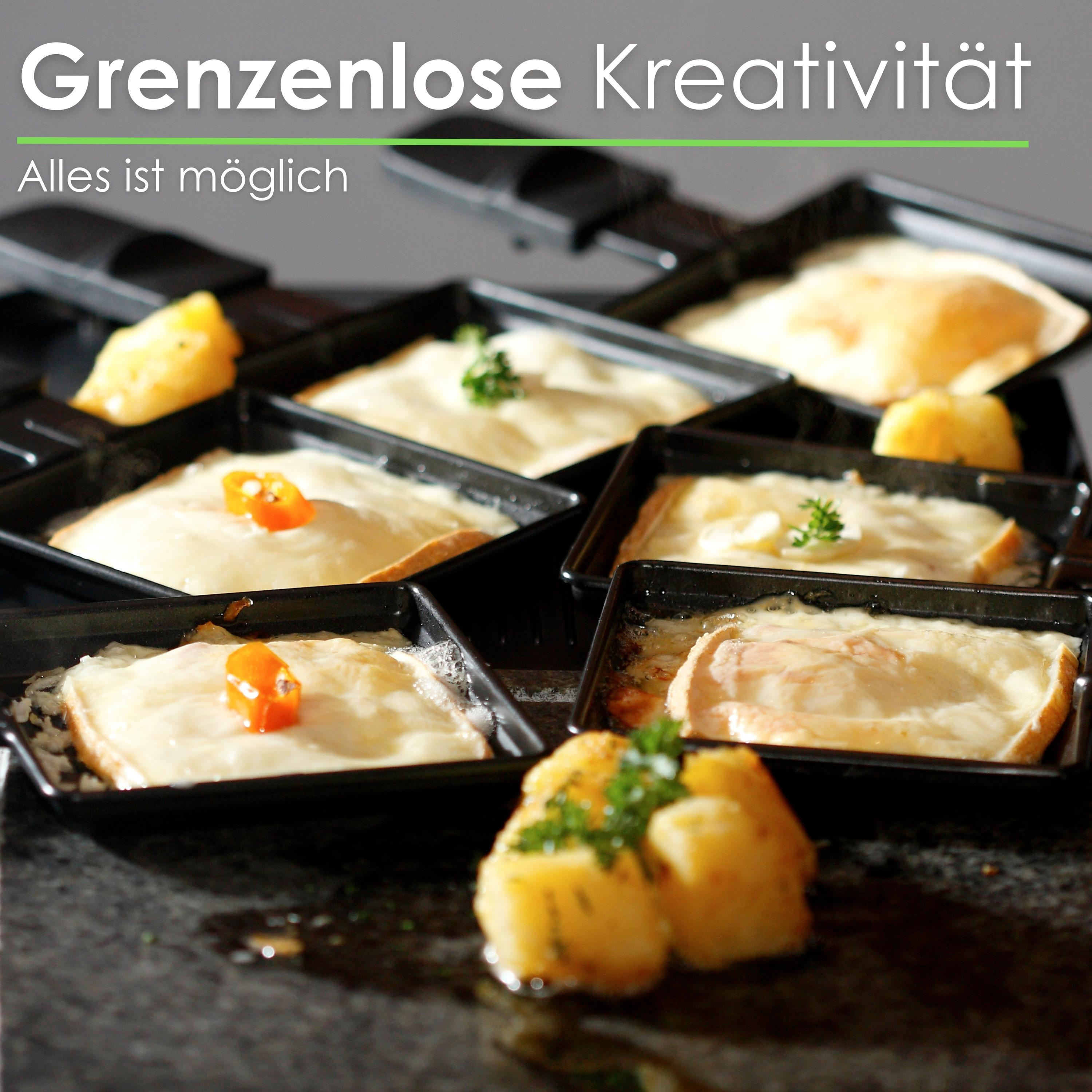Nahaufnahme von Essen in schwarzen Schalen mit deutschem Text: 'Grenzenlose Kreativität'.