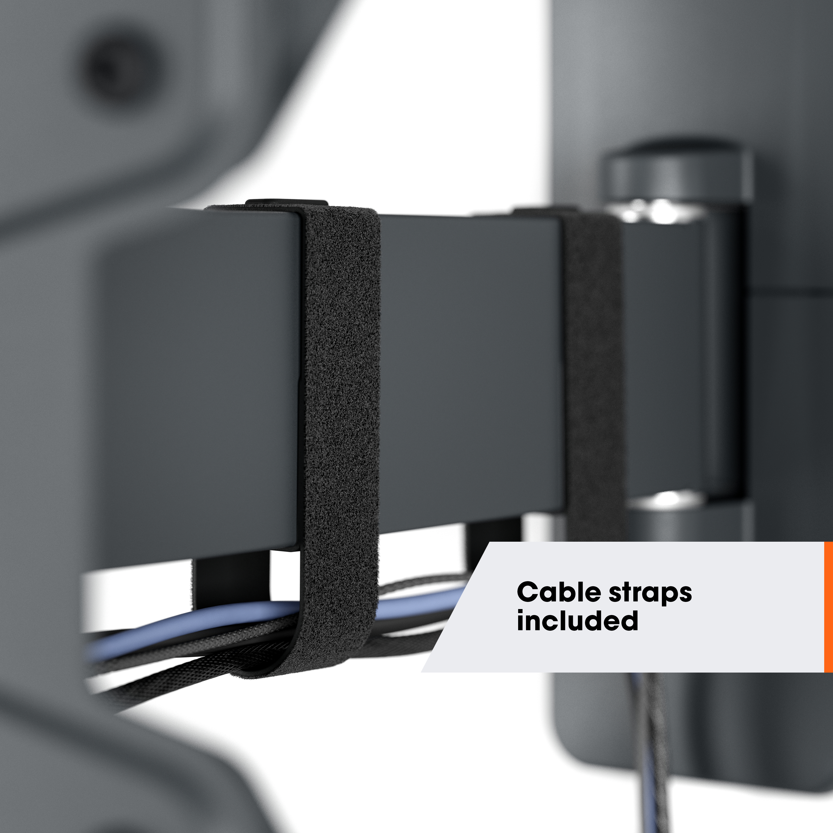 Zbliżenie czarnego systemu pasków kablowych z białym banerem z napisem 'Cable straps included'.