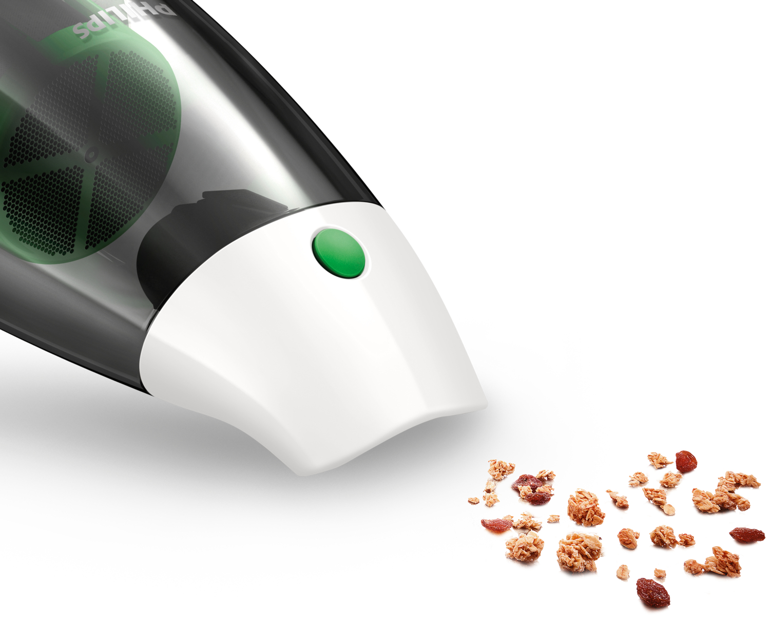 Aspirapolvere portatile che pulisce alcuni pezzi di cereali su una superficie bianca.