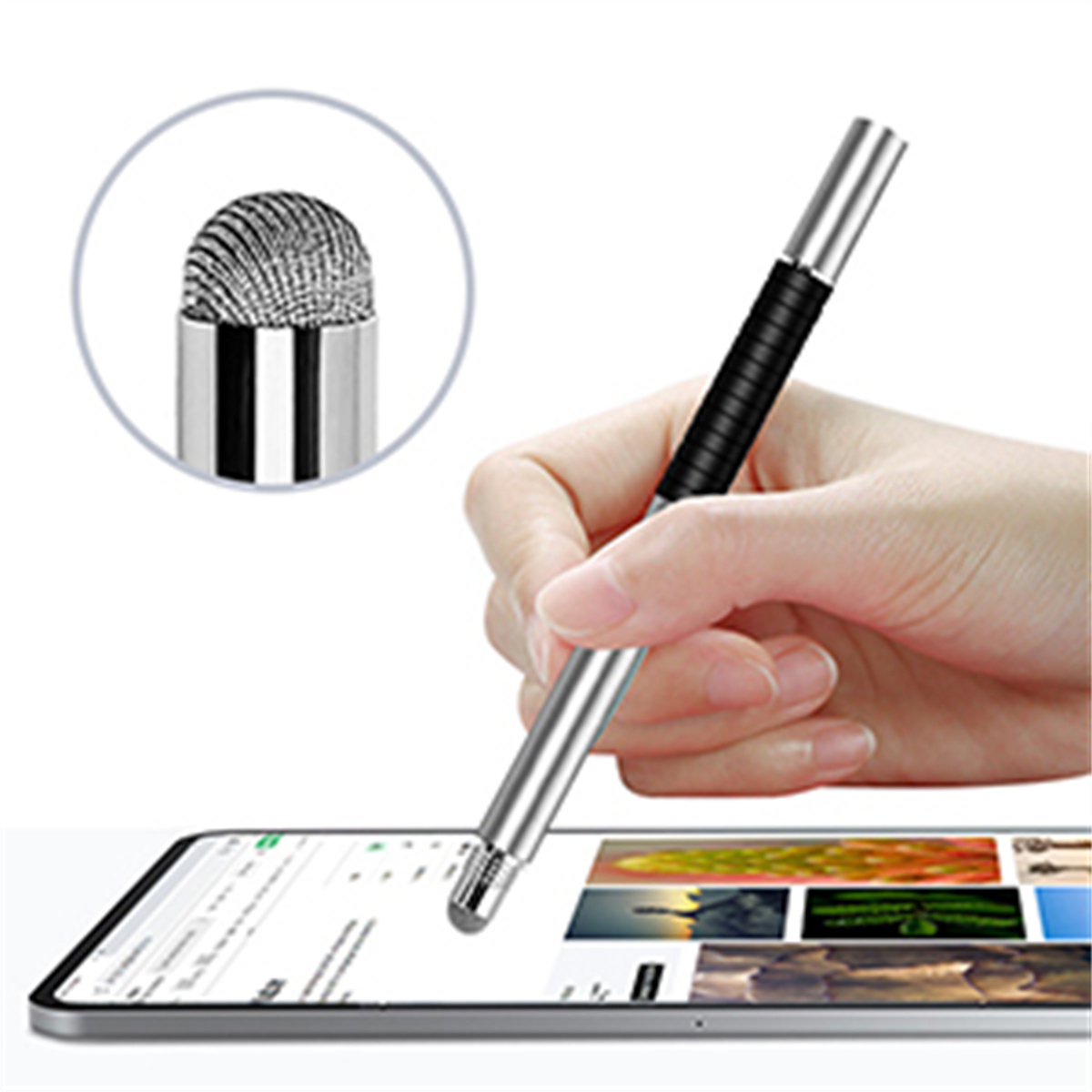 Eine Hand, die einen Stift über einem Tablet hält, mit vergrößerter Spitze.