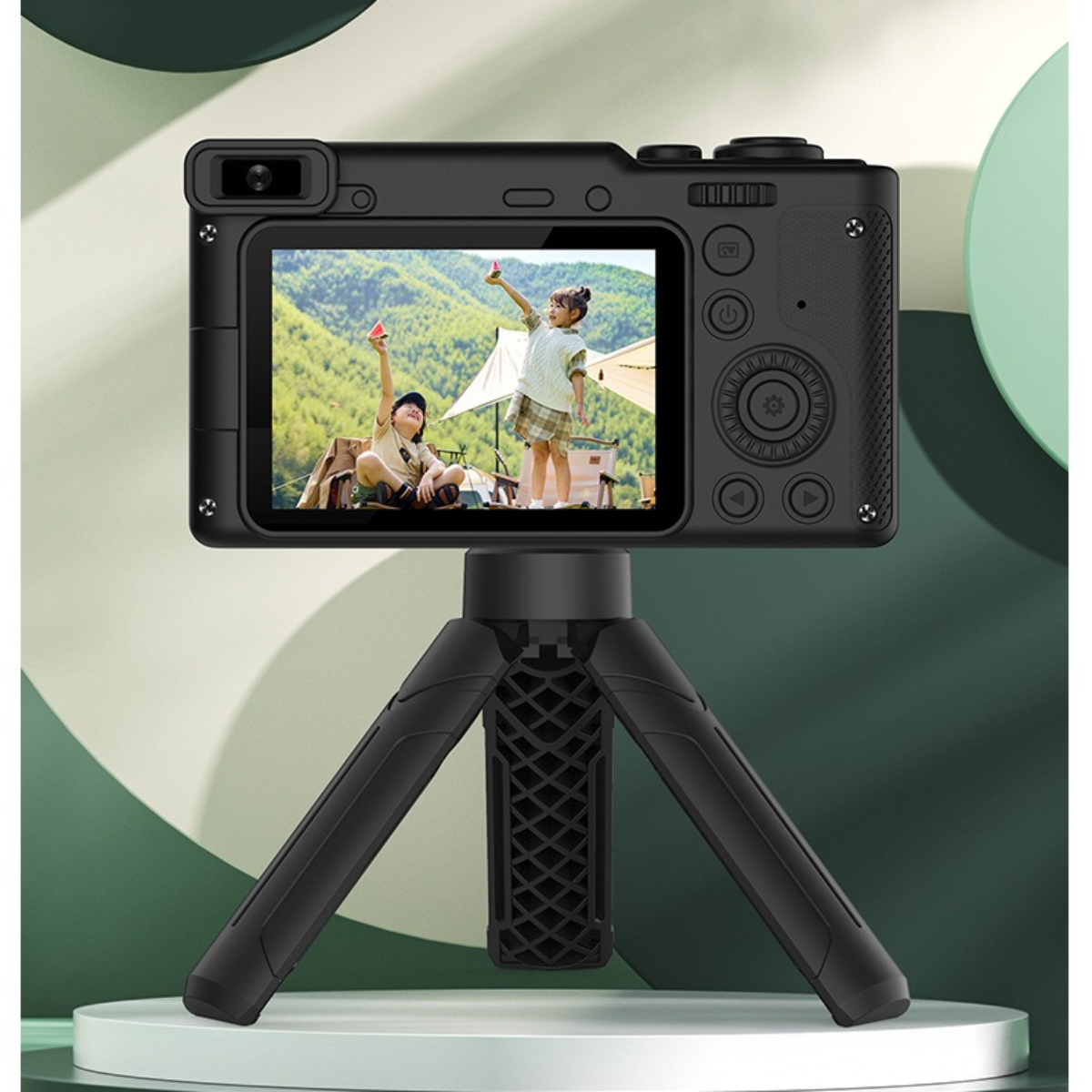 Eine schwarze Digitalkamera auf einem Stativ, die ein Foto von zwei Kindern anzeigt.