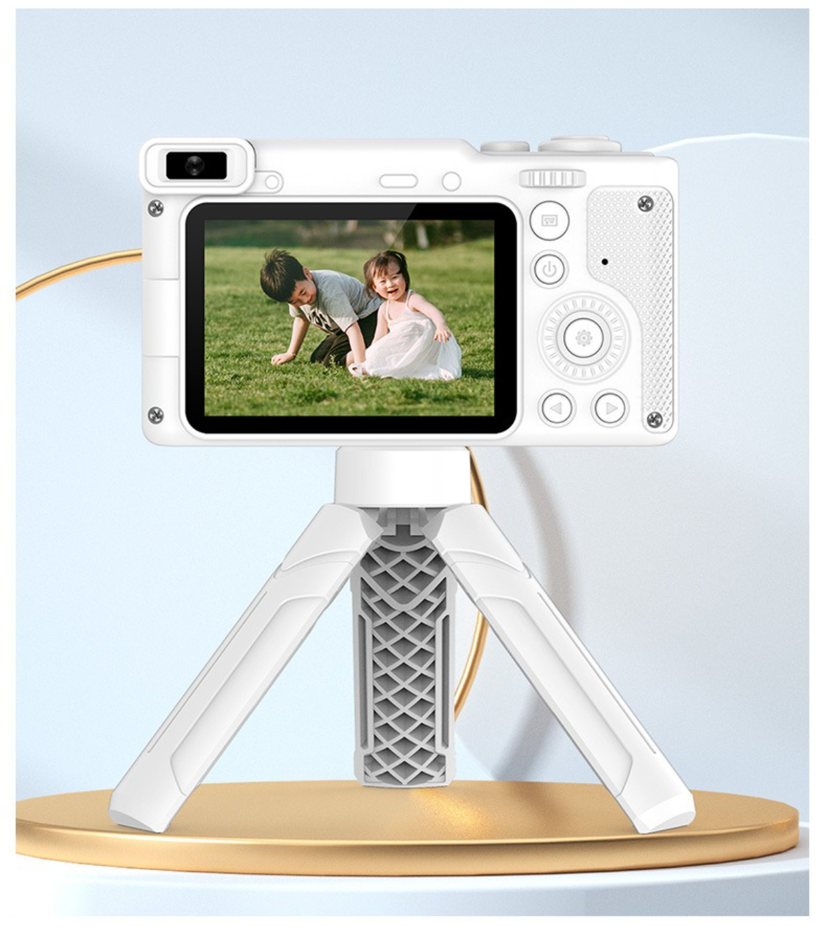 Weiße Digitalkamera auf Stativ, zeigt Foto von zwei Kindern.