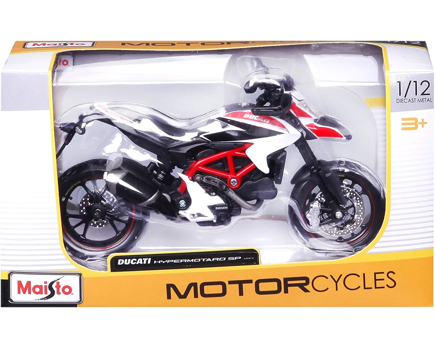 Ein Spielzeug-Ducati-Motorrad in einer Schachtel. Das Motorrad ist schwarz, rot und weiß.