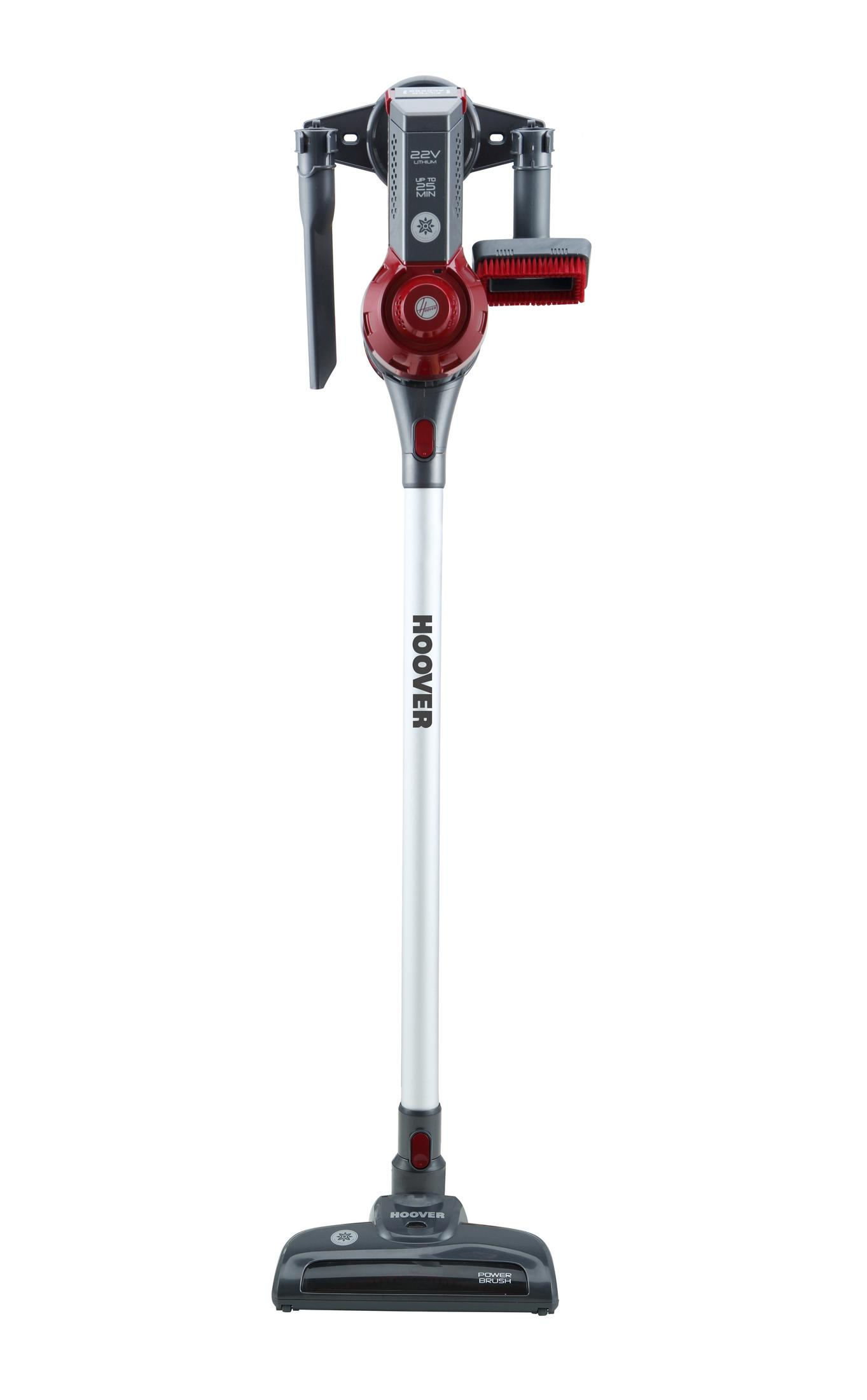 Un aspirapolvere bianco e rosso con un lungo manico e un accessorio a spazzola, marca HOOVER.