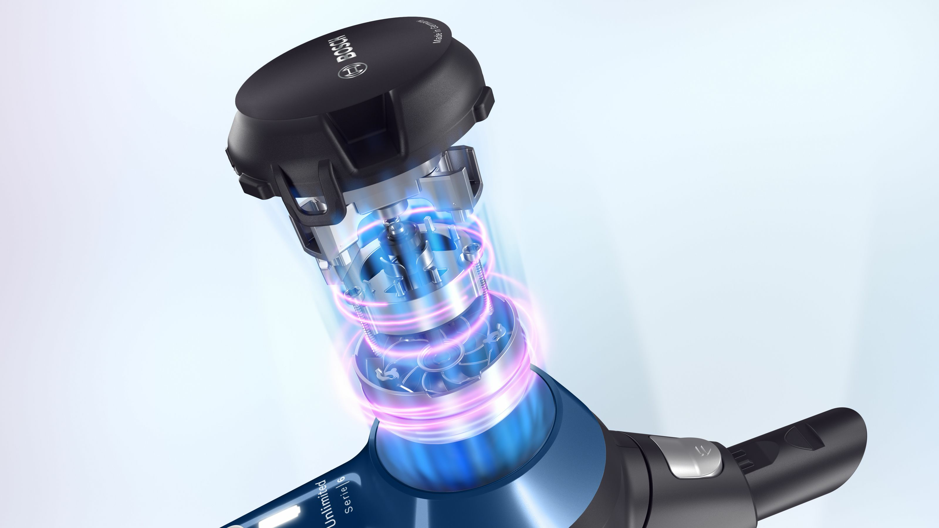 Zbliżenie silnika odkurzacza z efektem niebieskiego i różowego światła.