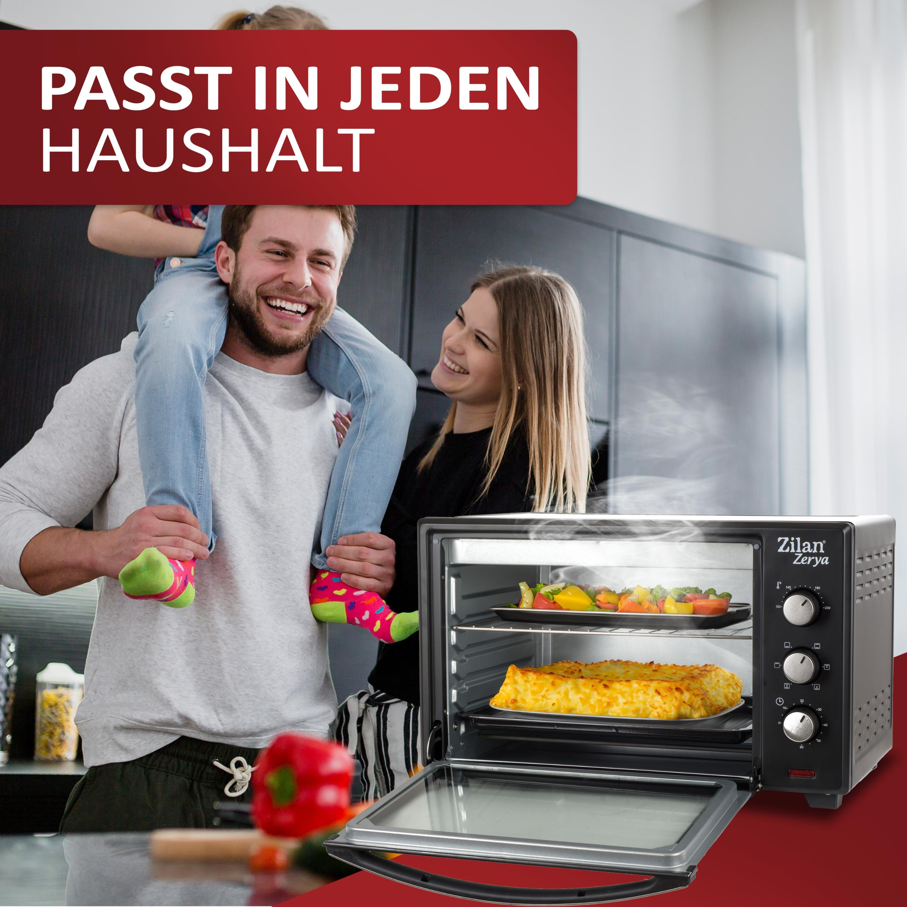 Rodzina w kuchni z otwartym piekarnikiem, chłopiec na ramionach. Piekarnik po prawej.