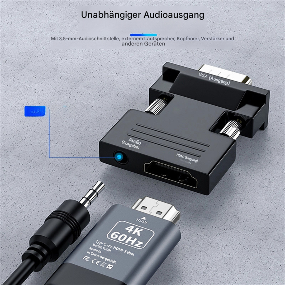 Ein schwarzer Adapter mit VGA- und HDMI-Anschlüssen, zusammen mit einer Audiobuchse und einem HDMI-Kabel.