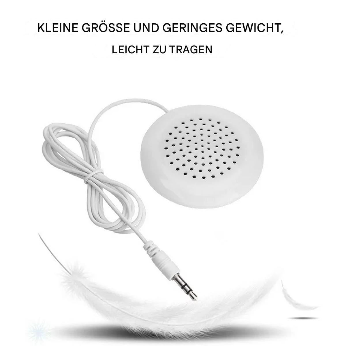 Ein kleiner weißer Lautsprecher mit Kabel. Zwei Federn im Bild unten.