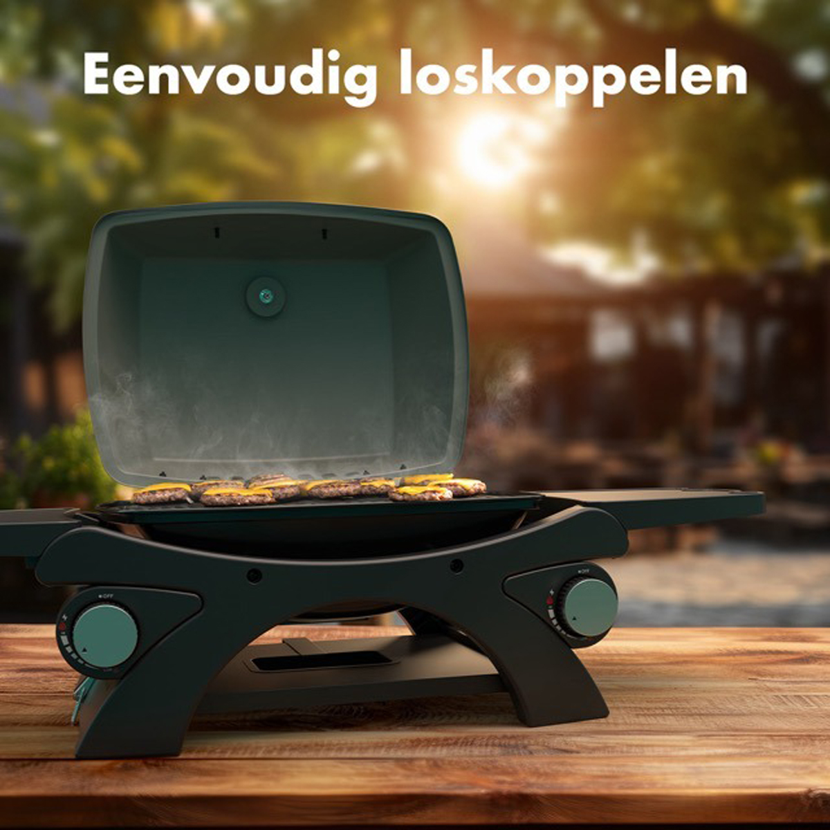 Black grill with burgers on it. Wooden table. Blurred green background with sun.