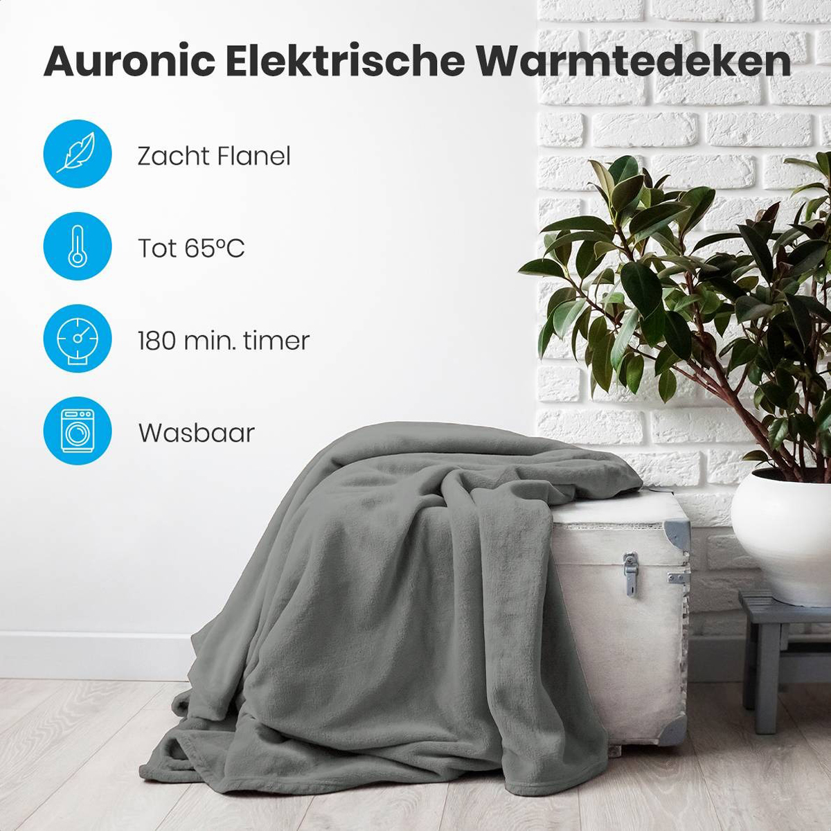 Grey electric blanket with icons and a white brick wall background, and a plant in a white pot.