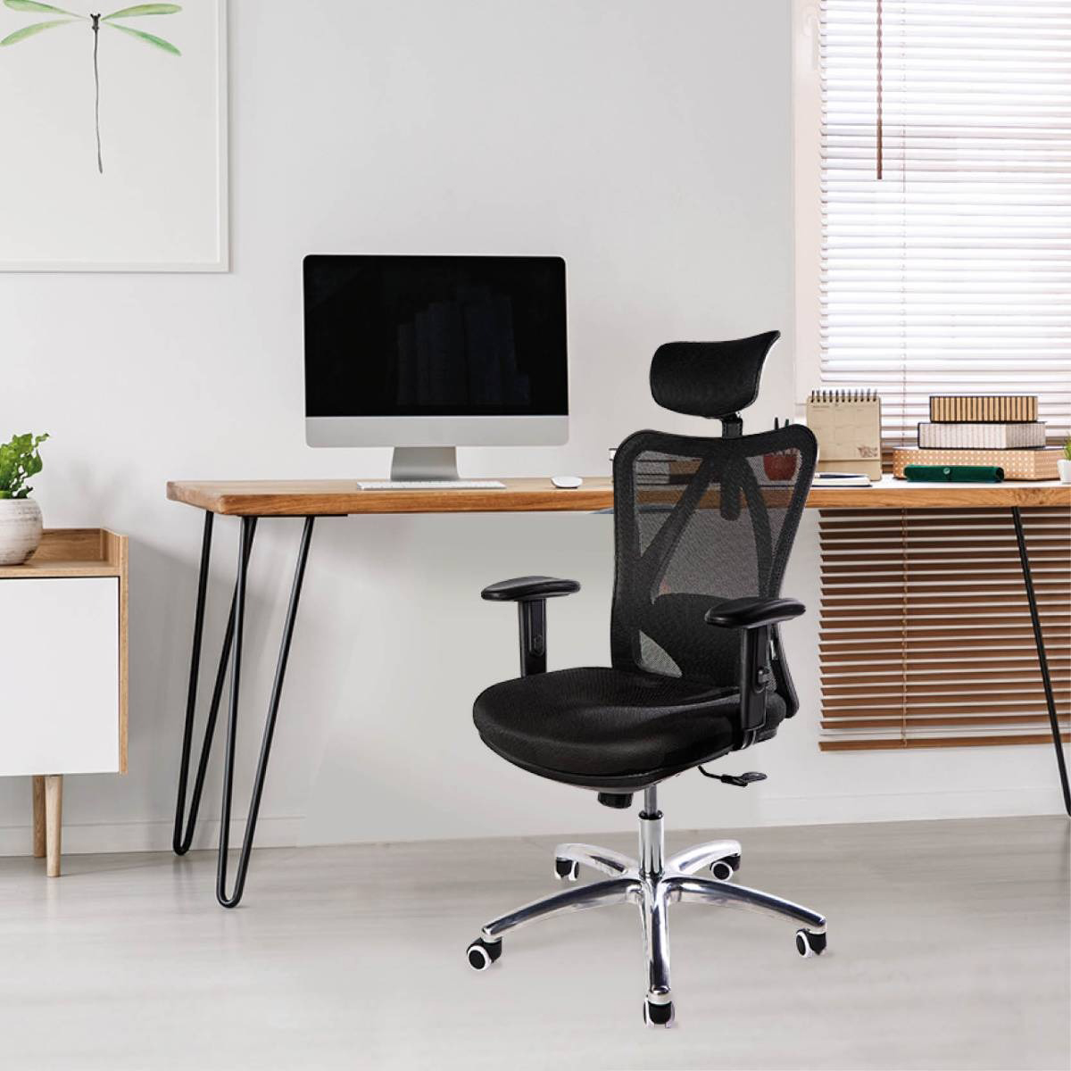 Office chair in a room with a desk, computer, and blinds on the window.