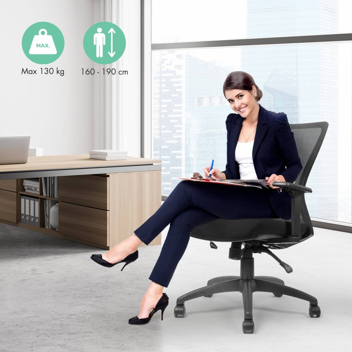 Woman in office chair writing on a clipboard, with desk and window.
