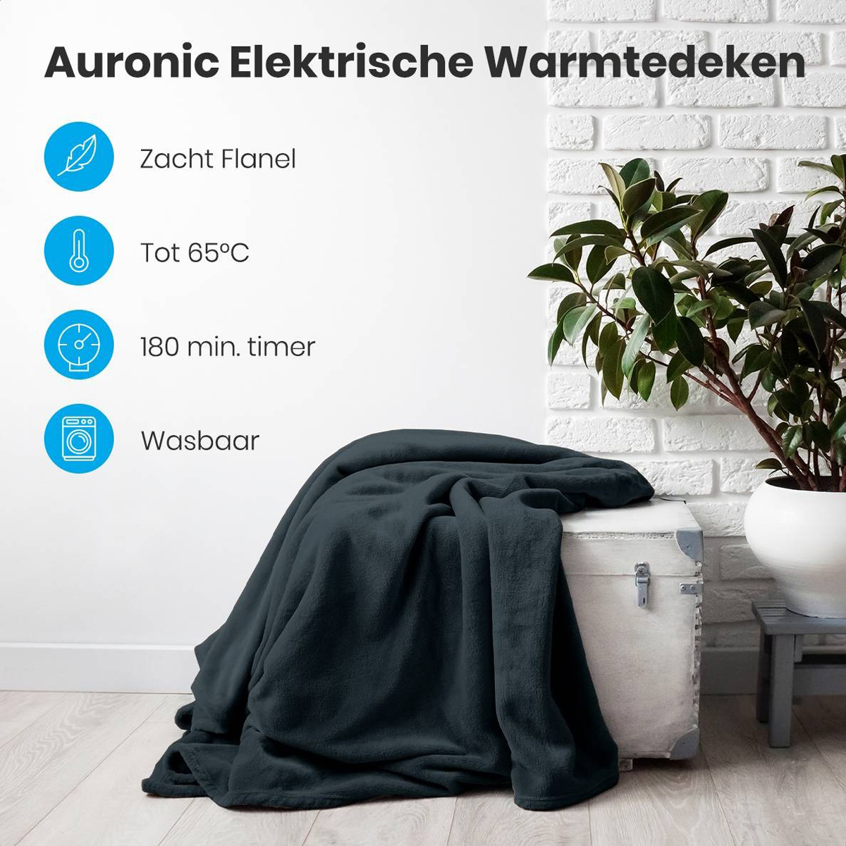Dark blanket on a trunk with text about soft flannel, 65C, 180 min timer, and washable.