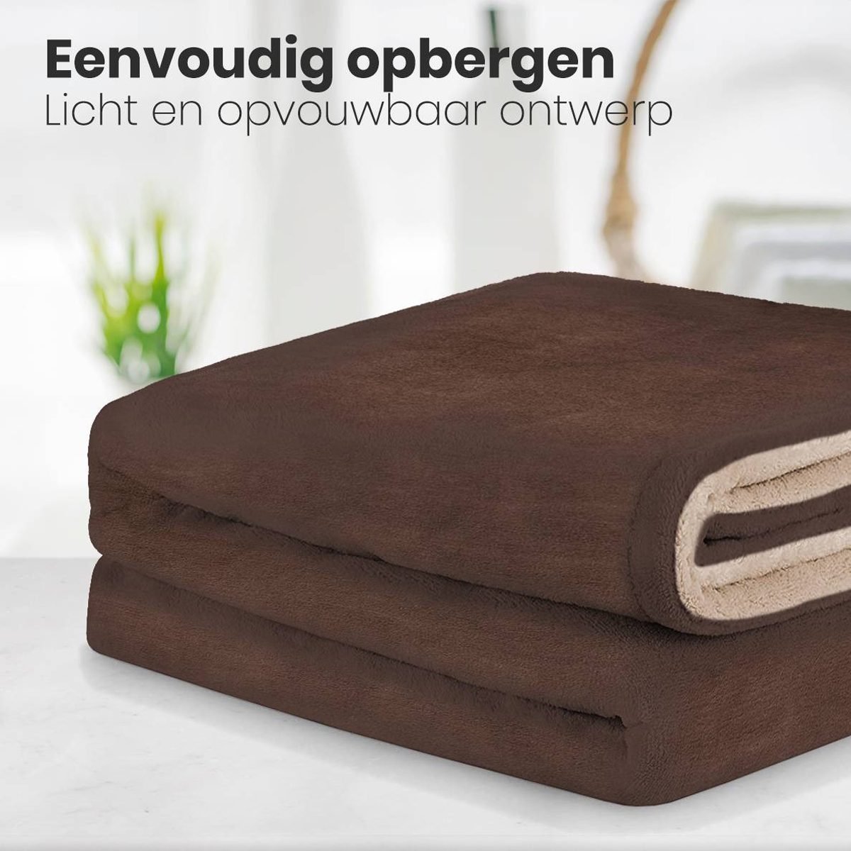 Folded brown blanket on a table, with a light-colored underside.