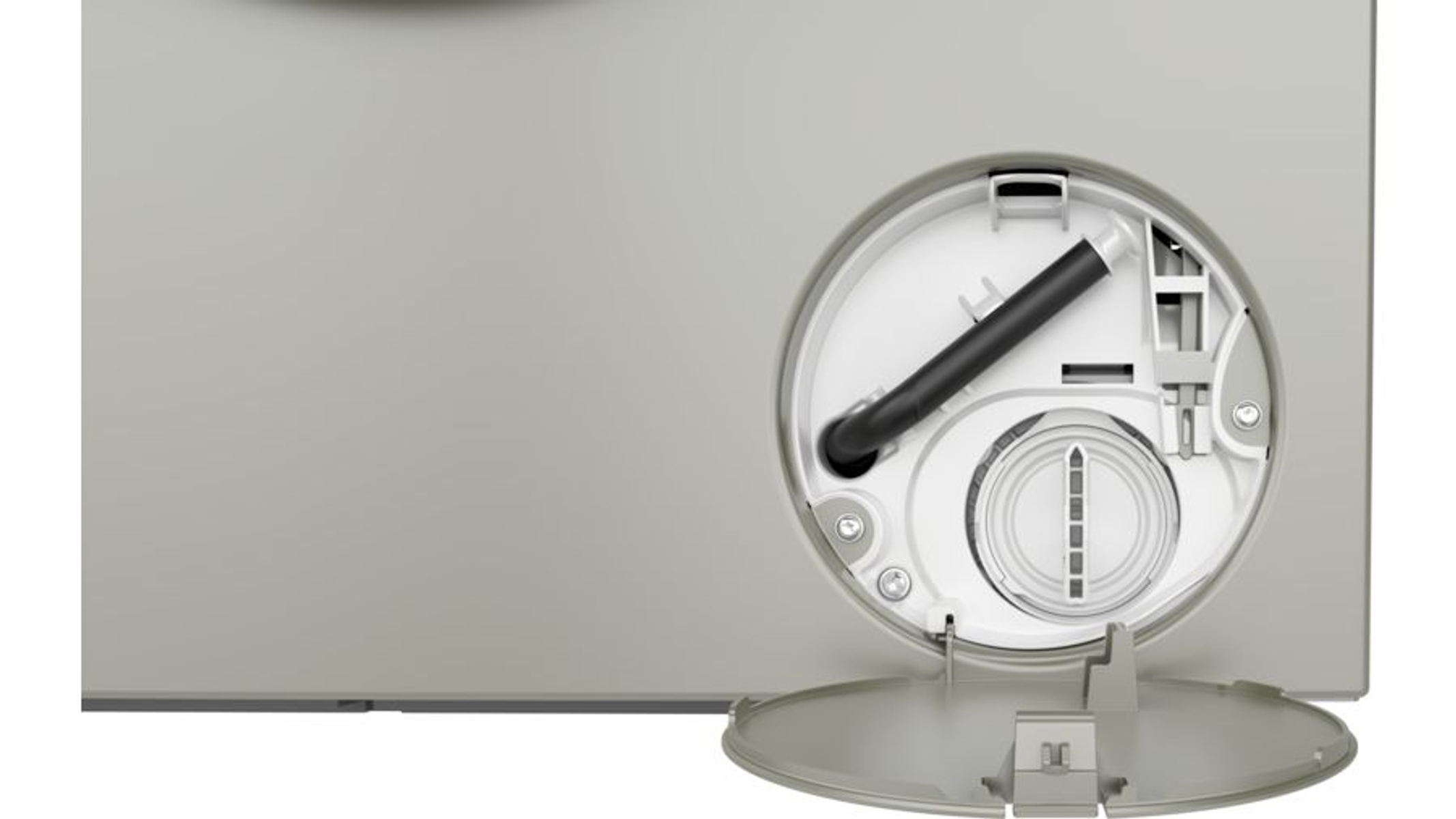 Zbliżenie elementu zbiornika na wodę, z okrągłym otworem i czarną rurką wewnątrz, na białej powierzchni.