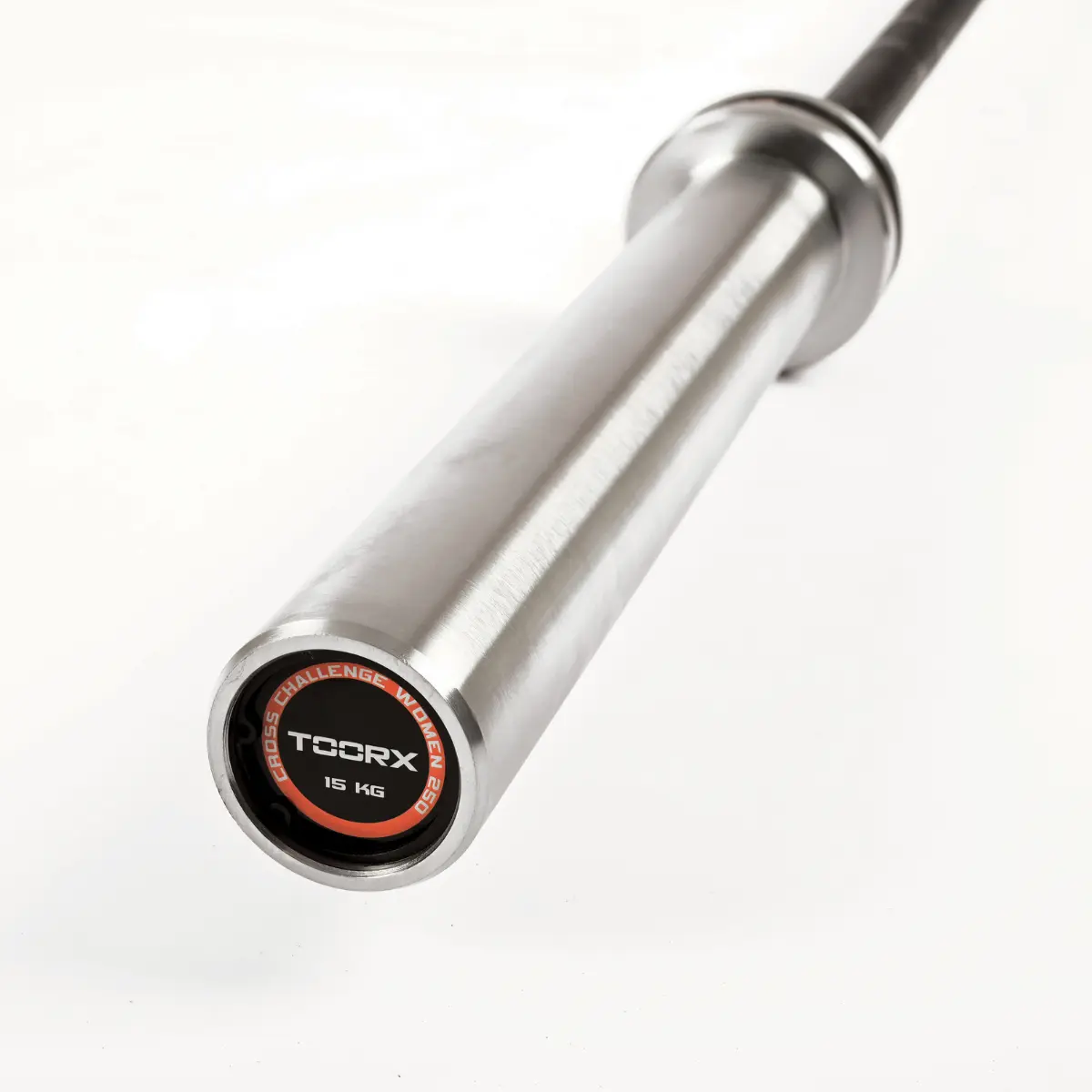 A silver barbell with black ends. The end cap reads: CROSS CHALLENGE WOMEN 15 KG.
