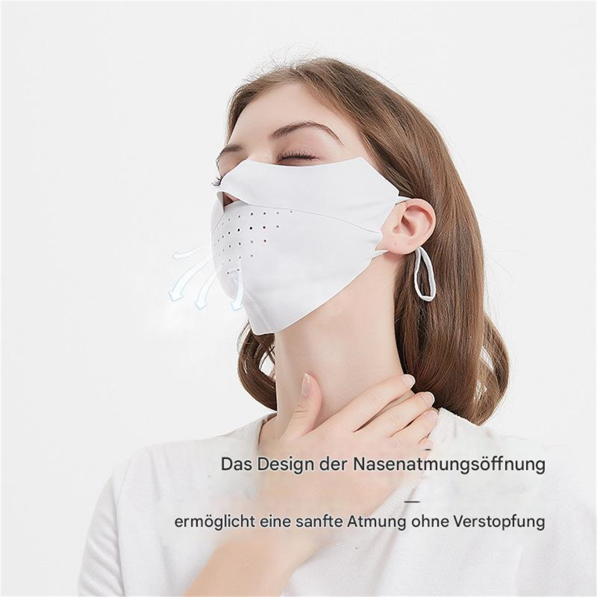Frau trägt weiße Gesichtsmaske mit Luftauslässen. Text unten: "Das Design der Nasenatmungsöffnung".