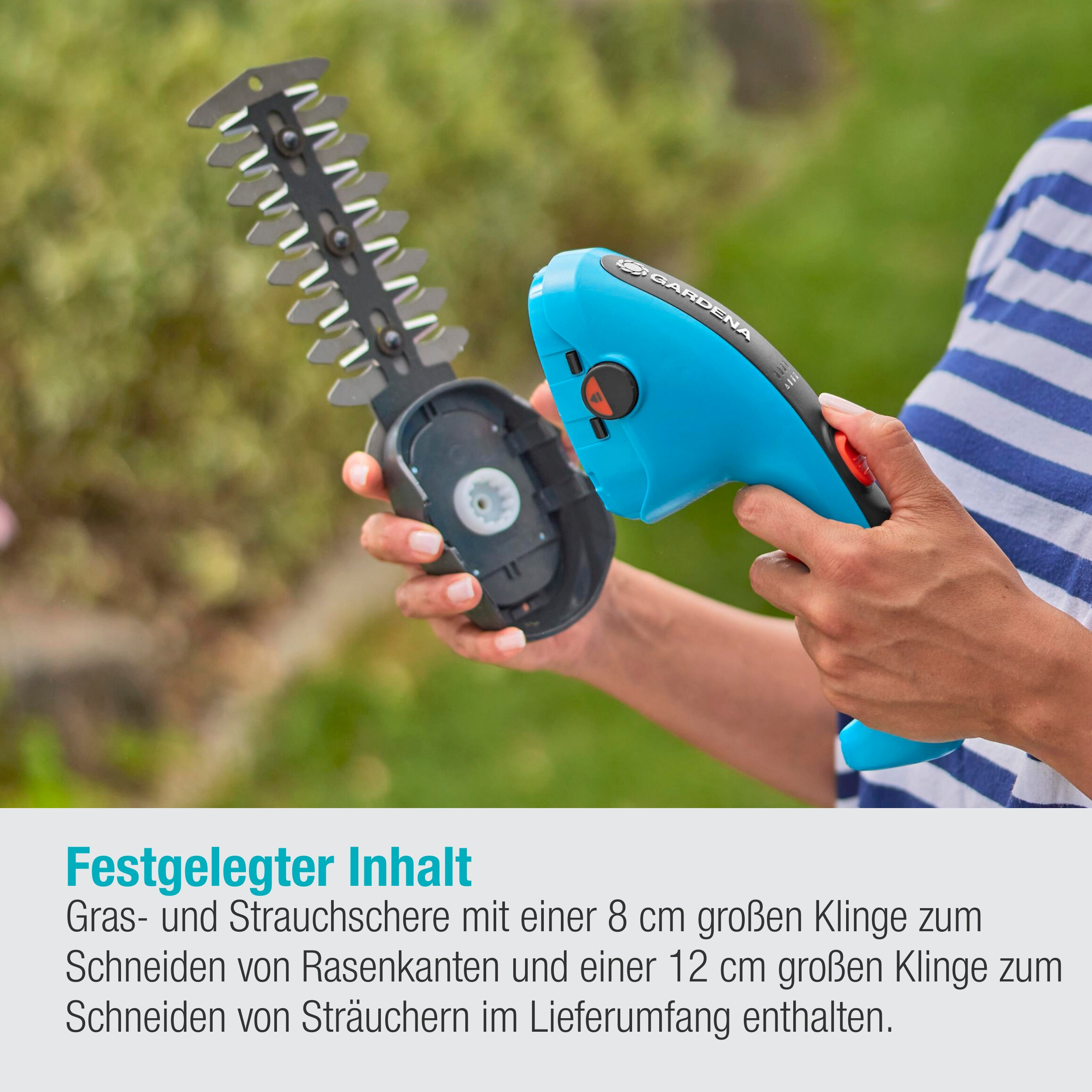 Ein blaues und schwarzes Gartengerät, wie eine Heckenschere, beim Schneiden von Gras im Garten.
