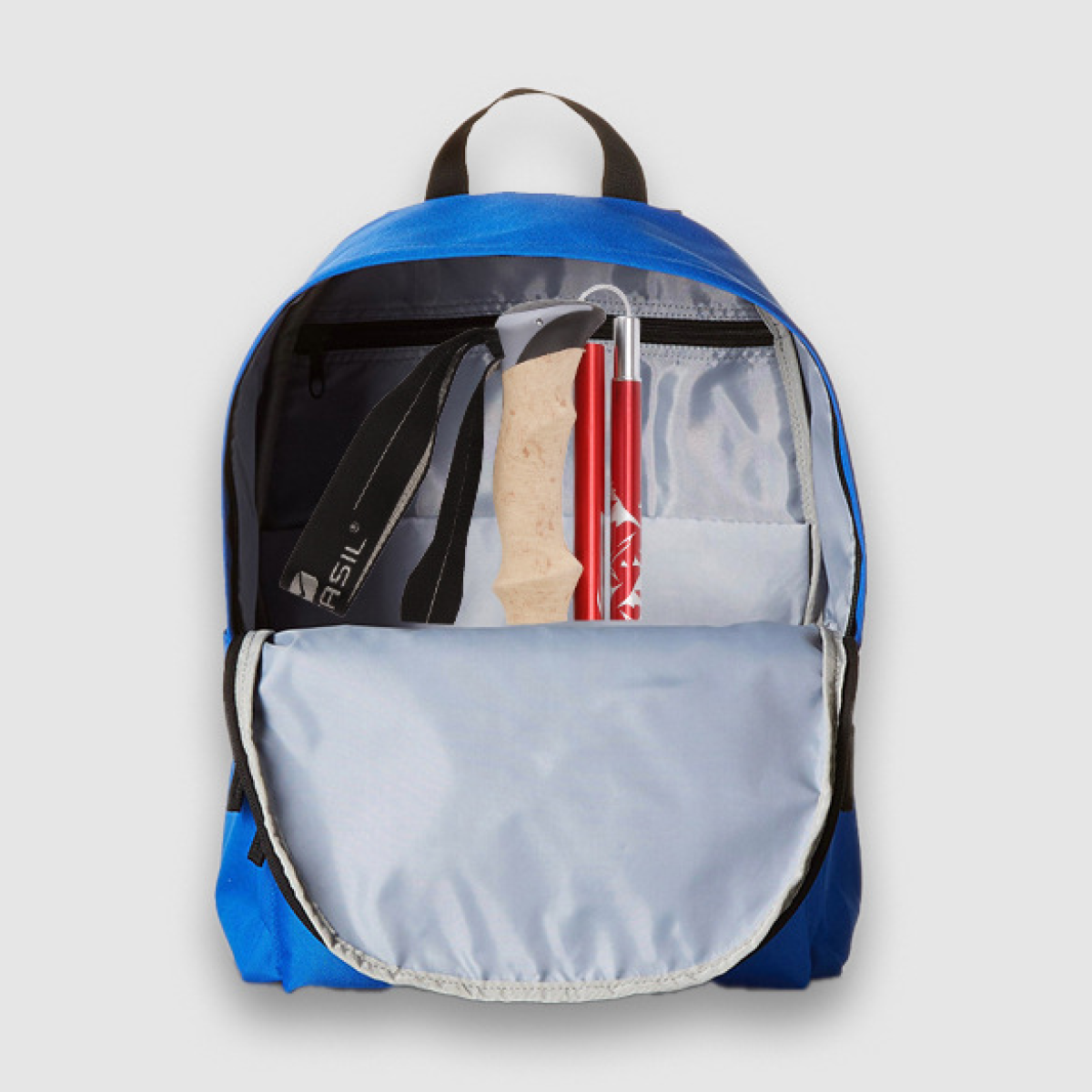 Blue backpack open with trekking poles inside. The backpack is on a light grey background.
