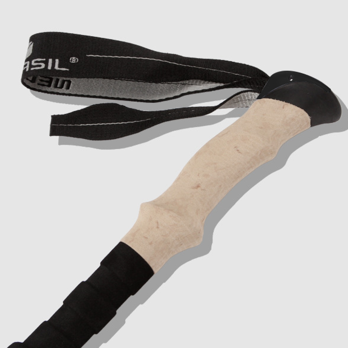 A black and white headband with a white logo and a light-colored handle.
