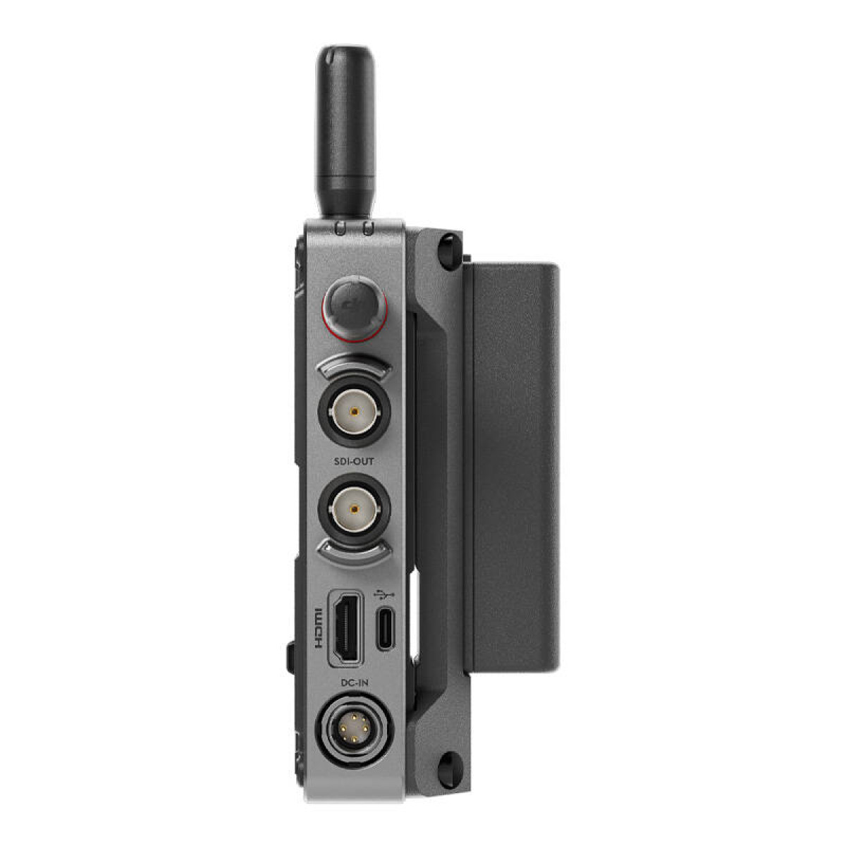 Una vista laterale di un dispositivo video grigio con porte e una batteria.