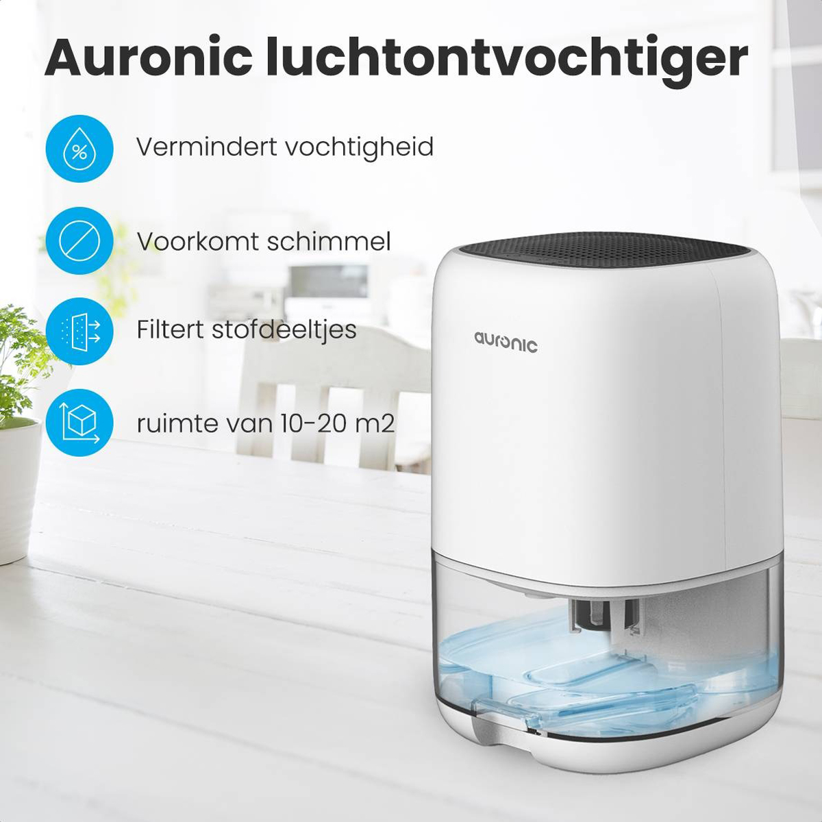 Een witte luchtontvochtiger met details en tekst op een houten tafel met een kleine plant.