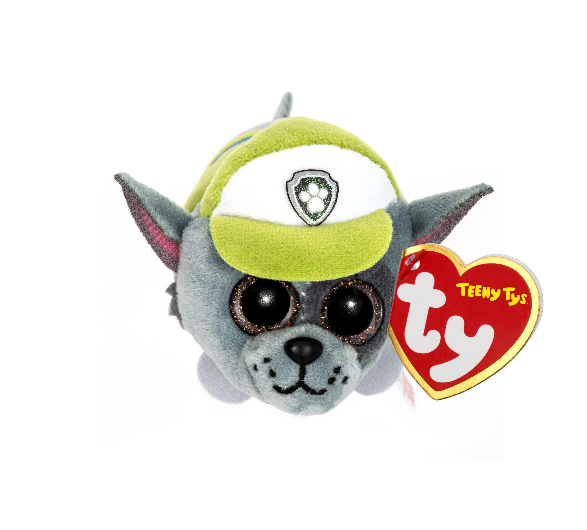 Ein graues Hundespielzeug mit grünem Hut mit Abzeichen und glitzernden Augen.