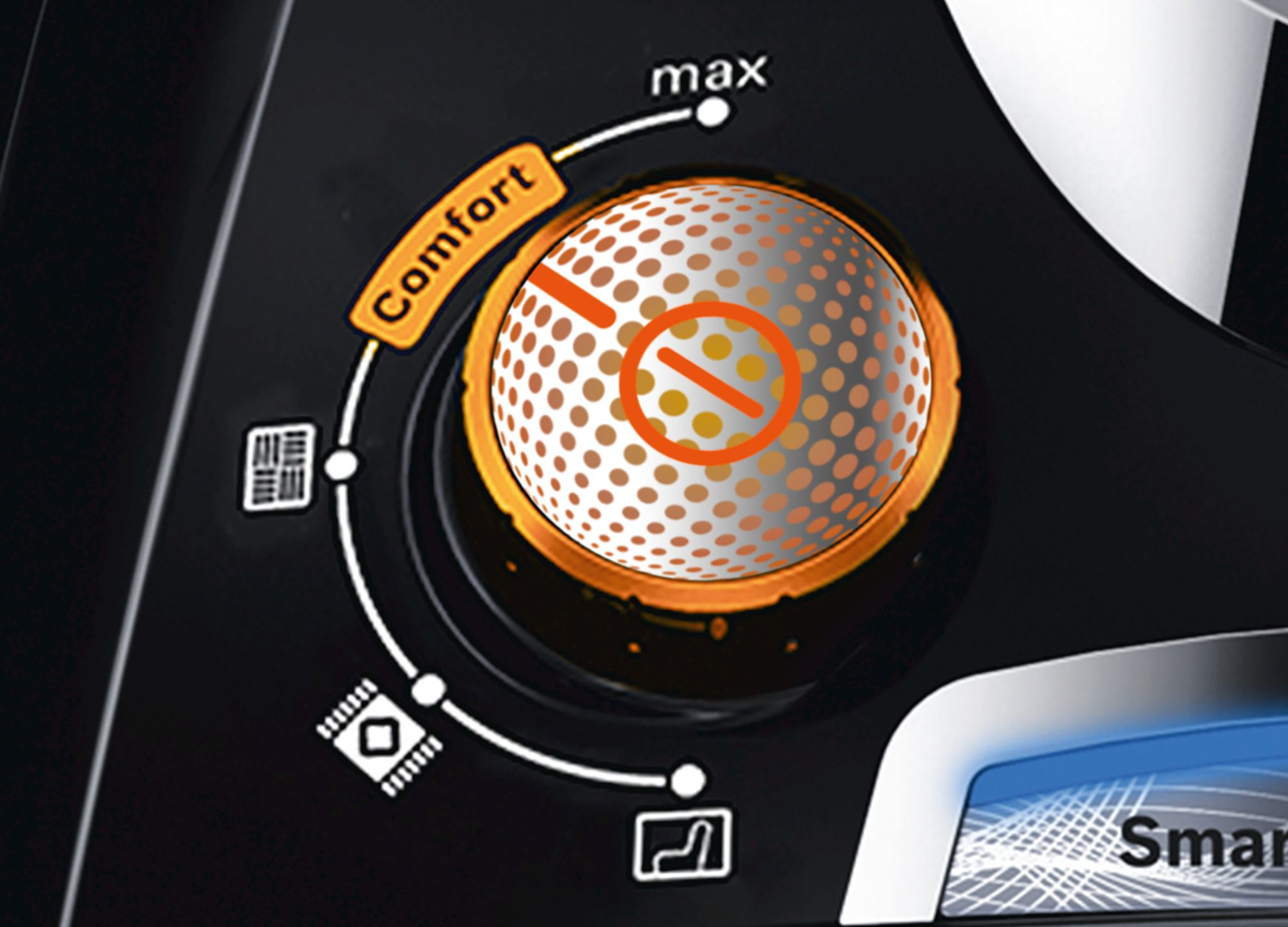 Pokrętło sterowania samochodu z ustawieniami komfortu. Pokrętło jest pomarańczowe.