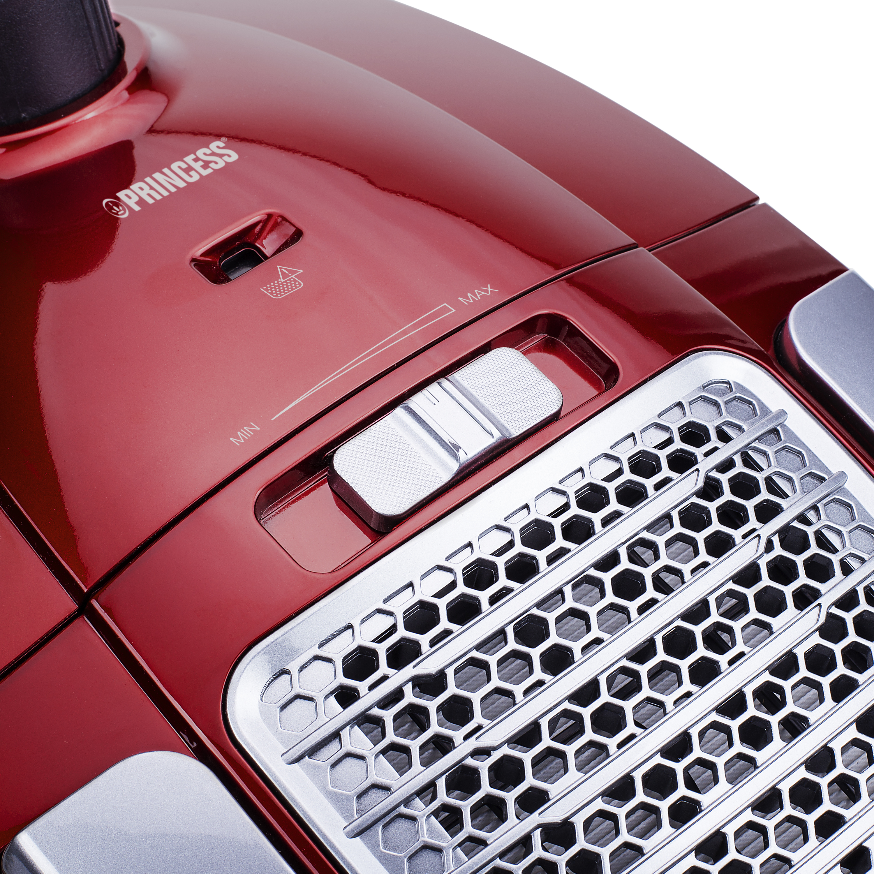 Zbliżenie na czerwony detal odkurzacza z suwakiem i kratką wentylacyjną.