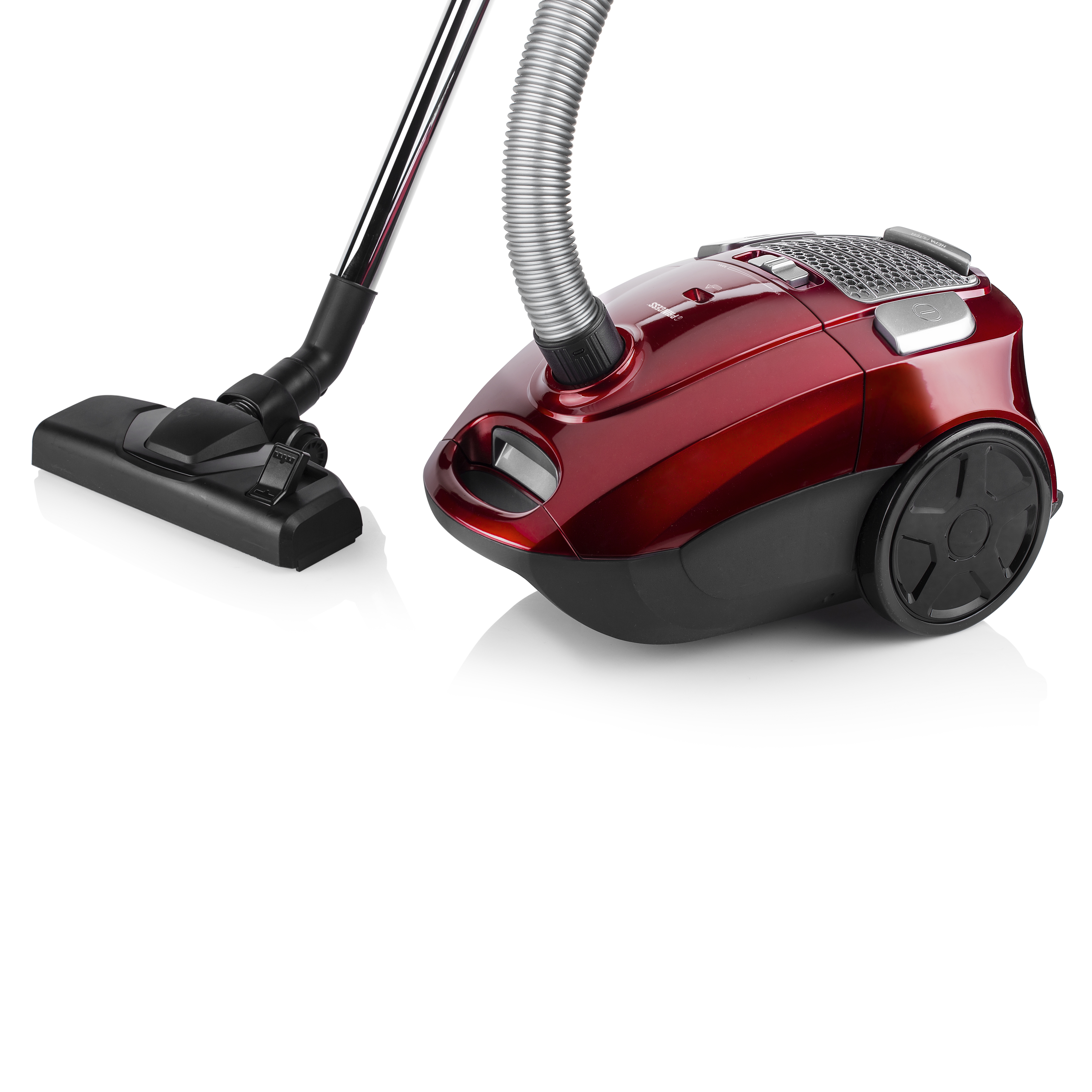 Czerwony odkurzacz z czarną głowicą i srebrną rurą na białej powierzchni.