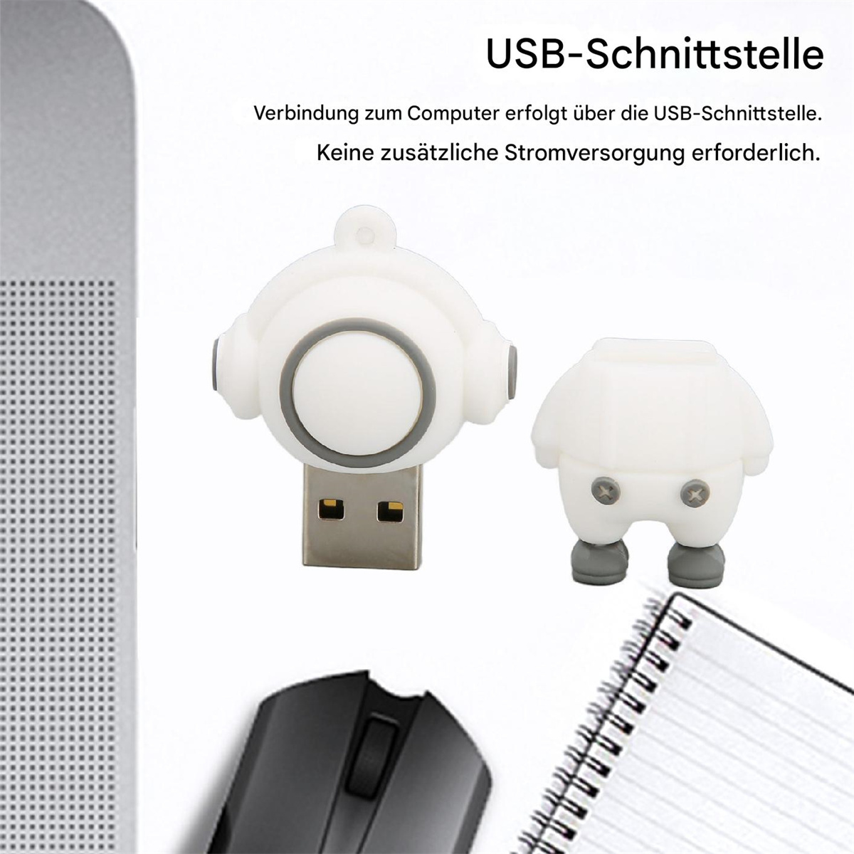 Weißer USB-Stick in Form einer Zeichentrickfigur. Notizbuch und Maus im Hintergrund.