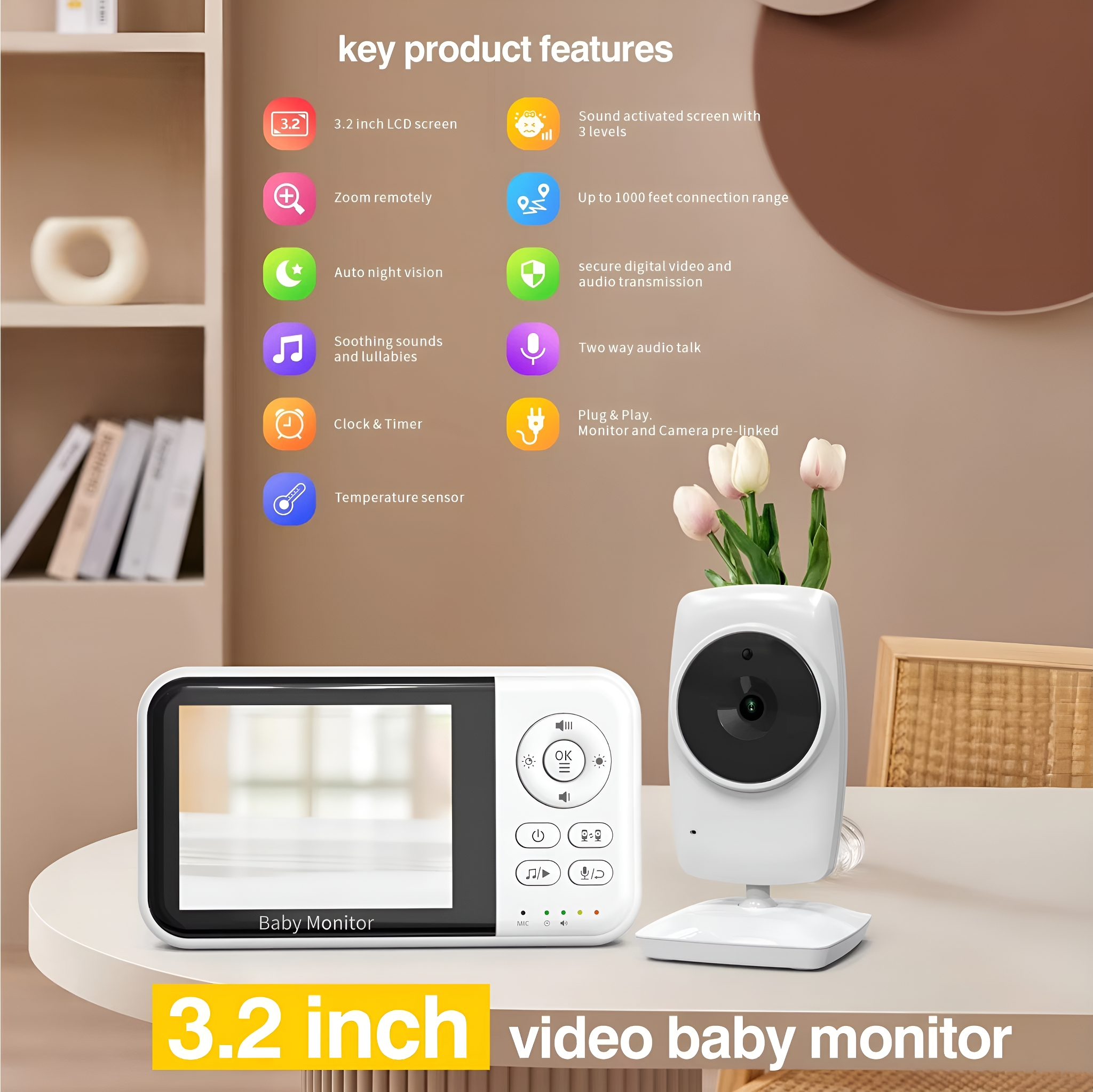 Babyphone mit Bildschirm und Funktionen, und eine Vase mit Blumen.