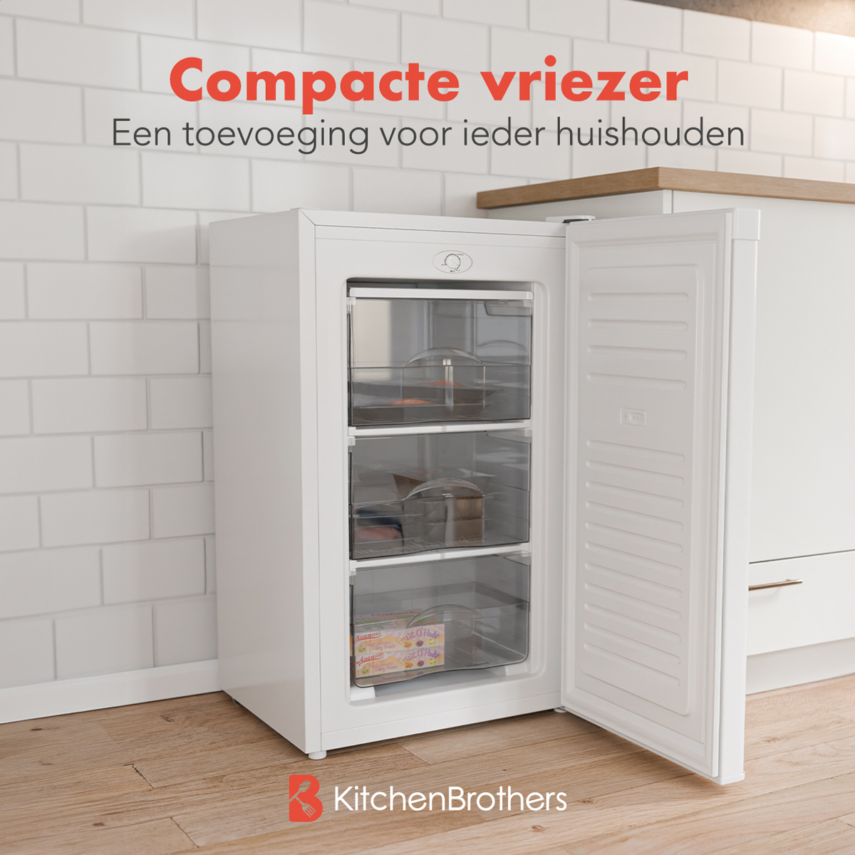 A white refrigerator with the door open. The text says 'Compact freezer'.