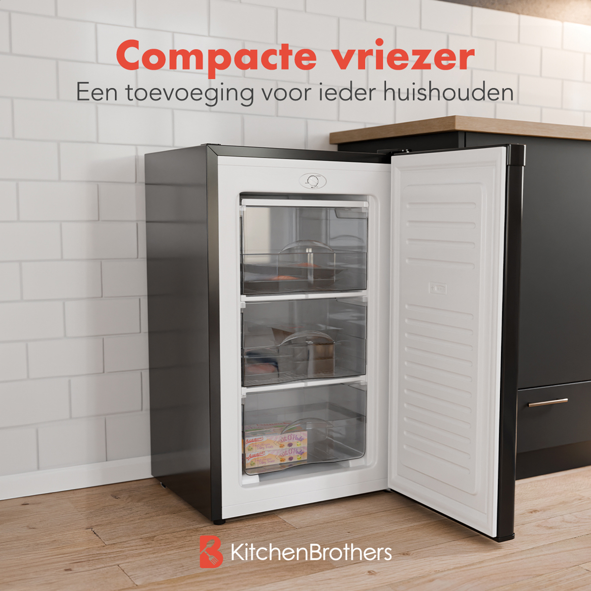 Black freezer with open door showing drawers. Text: 'Compact freezer, an addition'.