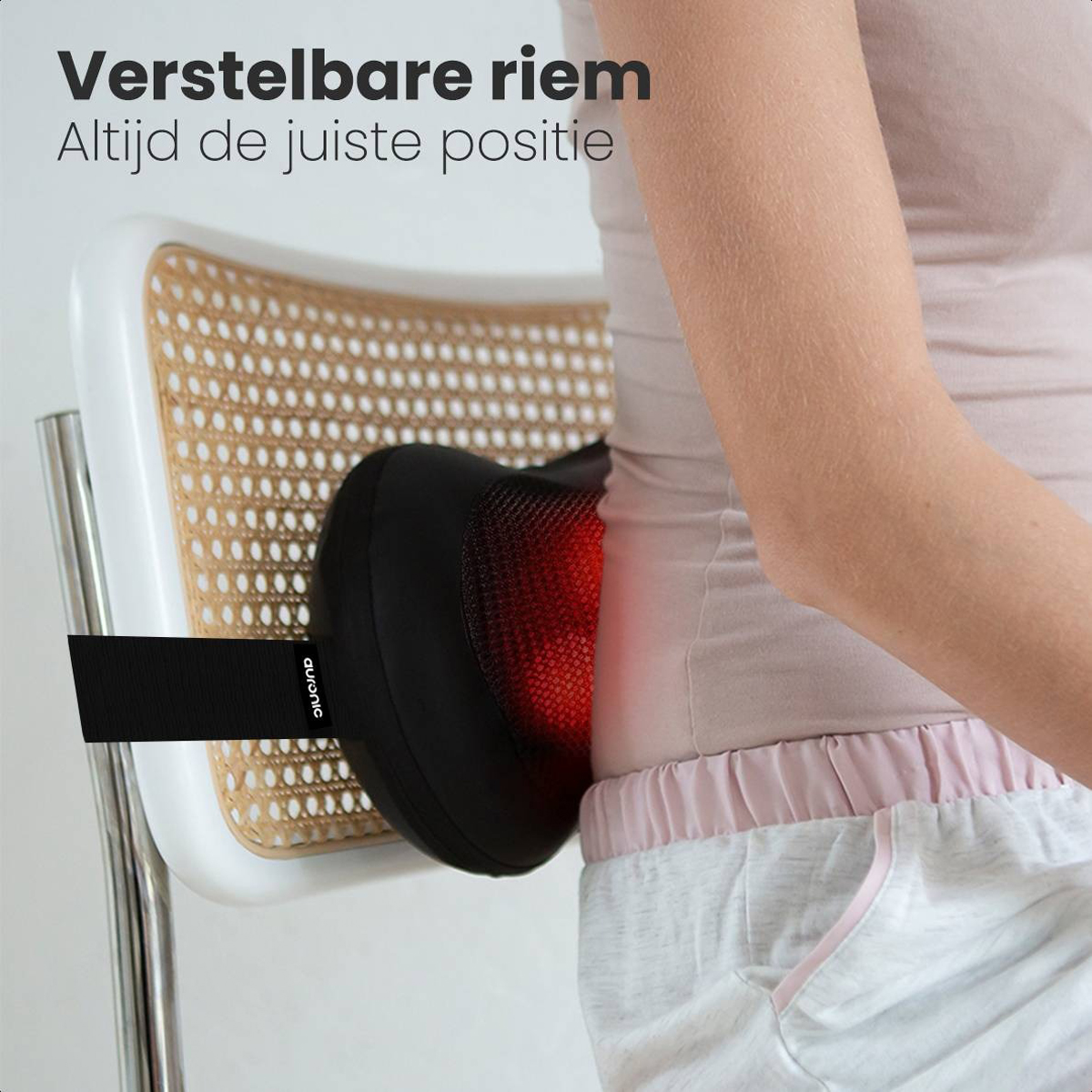 A person using a back massager on a chair. Text reads: Adjustable strap. Always the right position.