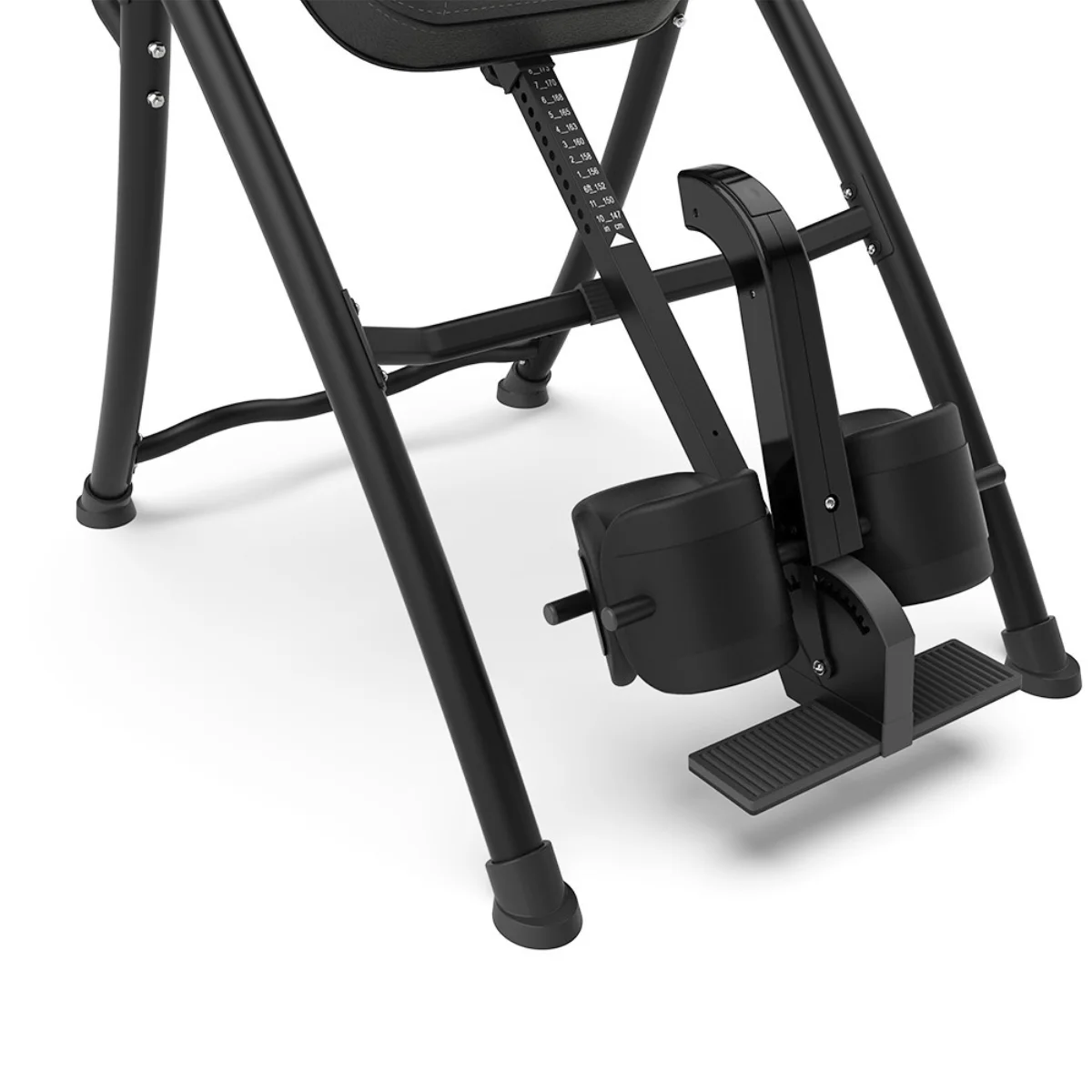Black inversion table with foot supports and a black frame.