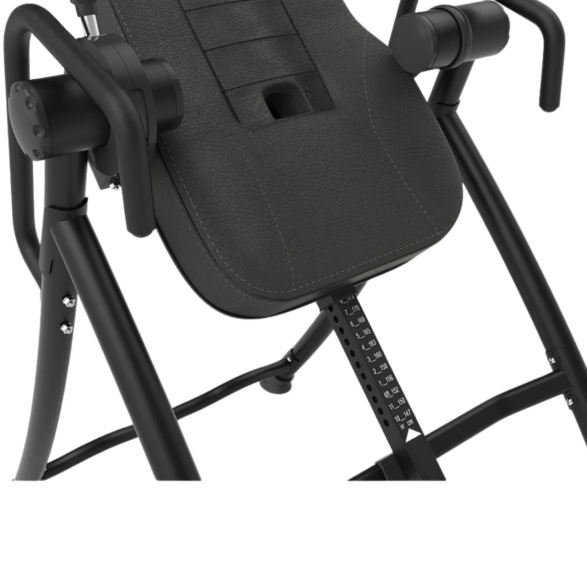 An inversion table in a room. It has a dark gray seat and black frame.