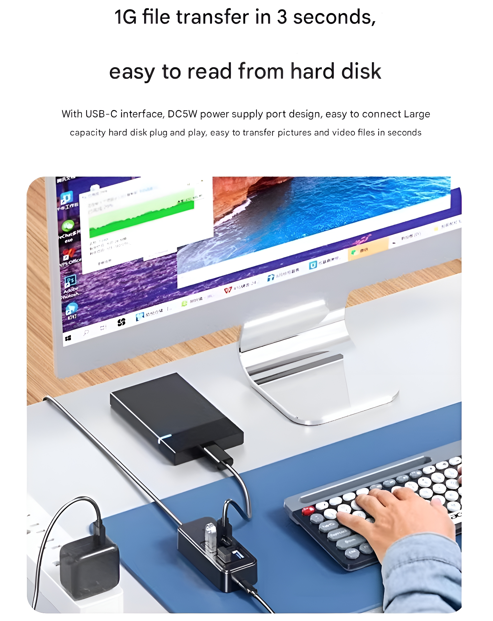 Ein Computer-Setup mit Monitor, Tastatur und Festplatte. Der Text lautet '1G-Dateiübertragung'.