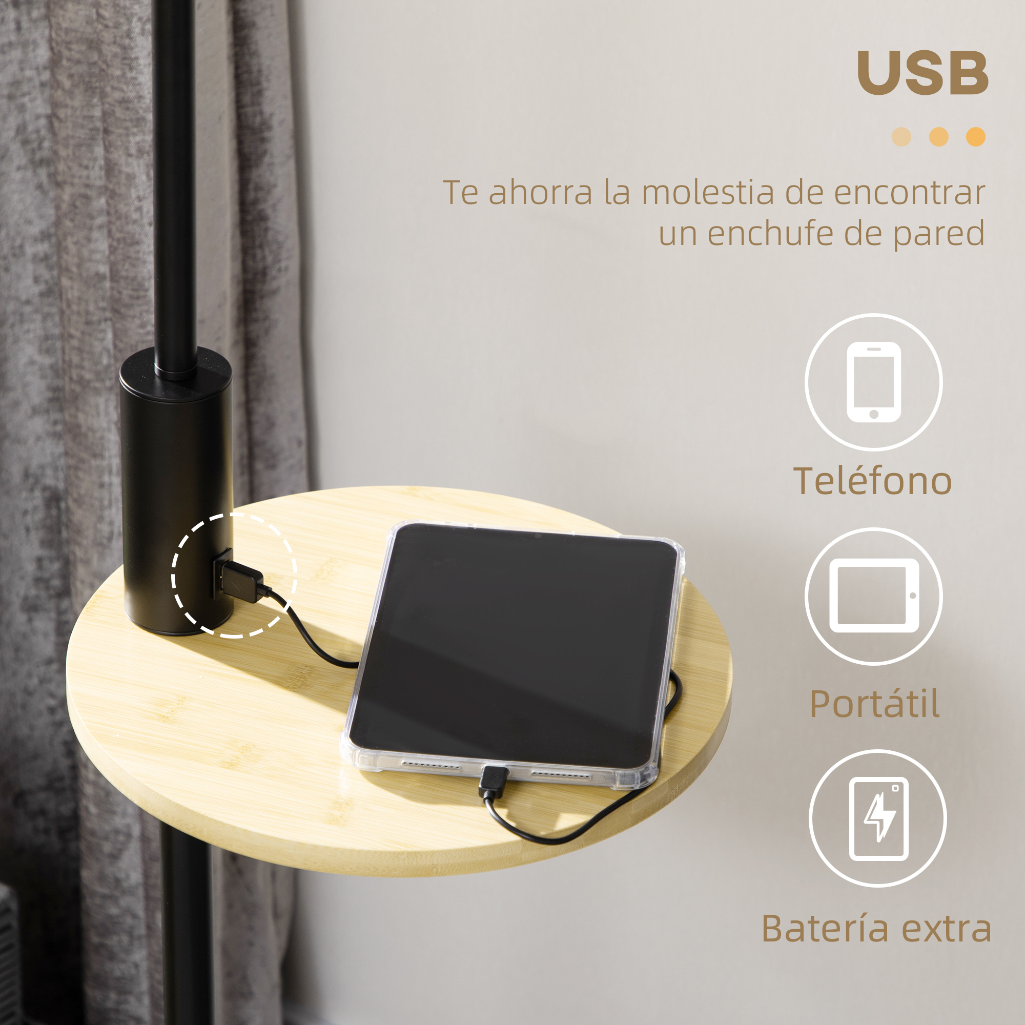 Una mesa negra con una tableta cargando, texto sobre USB, un teléfono y un portátil.