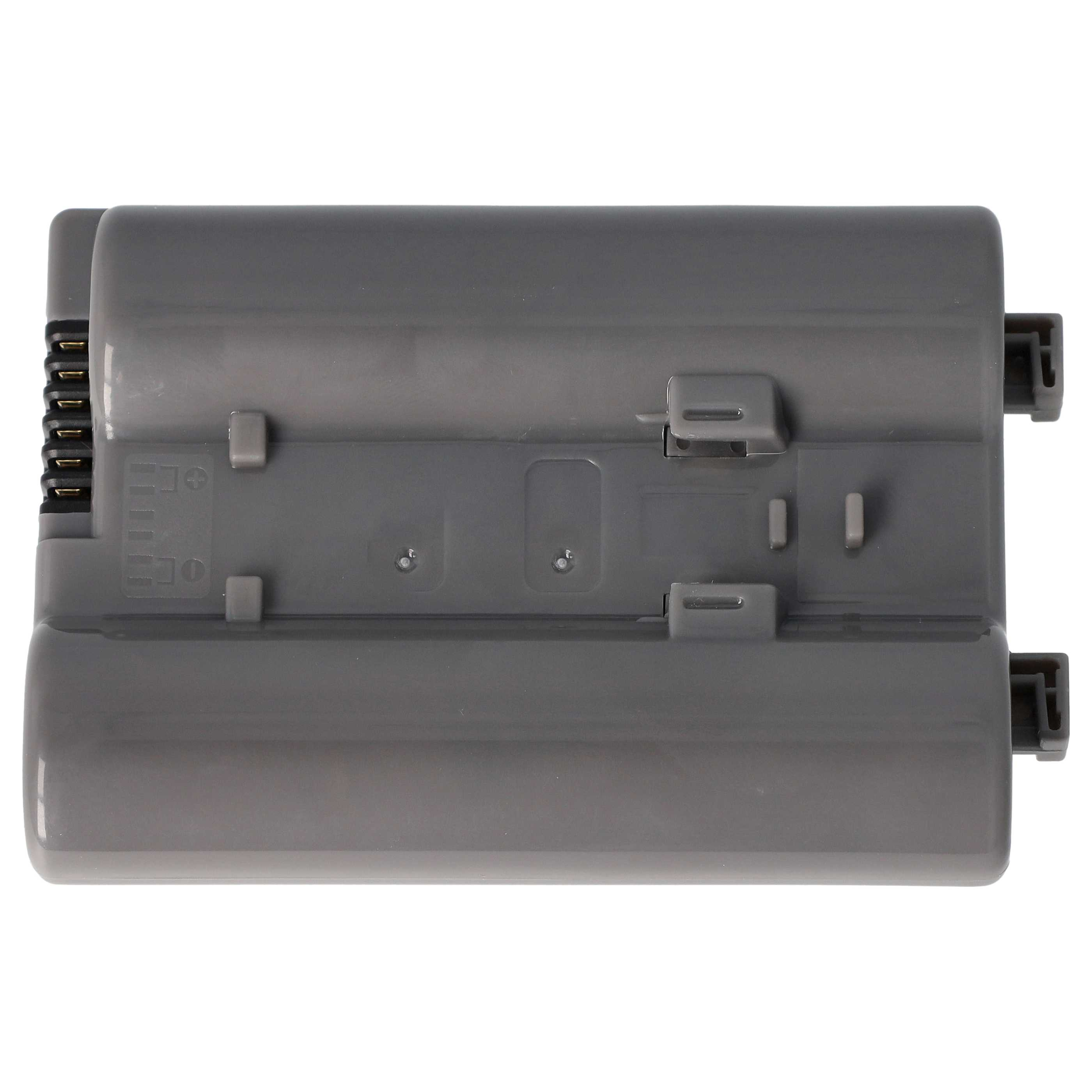 Eine graue Batterie. Sie hat eine rechteckige Form mit mehreren Stiften oben und unten.