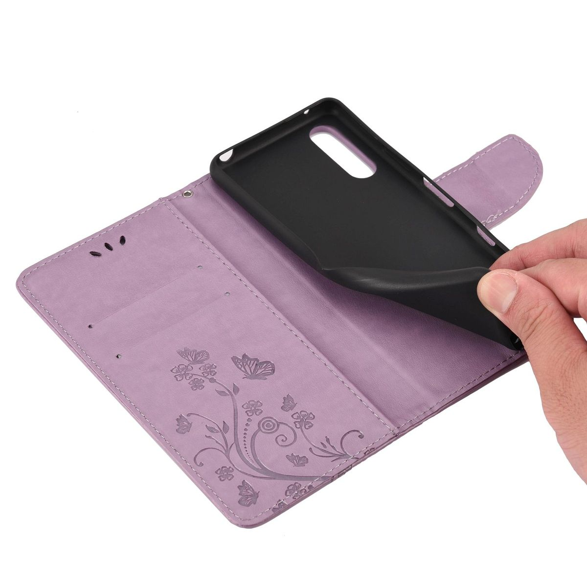 Lila Handyhülle mit Blumenmuster, offen, zeigt einen schwarzen Telefonhalter.