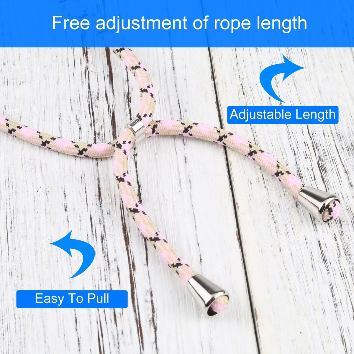 Nahaufnahme eines rosa-weißen Telefon-Lanyards. Es hat Text, Pfeile und silberne Spitzen.