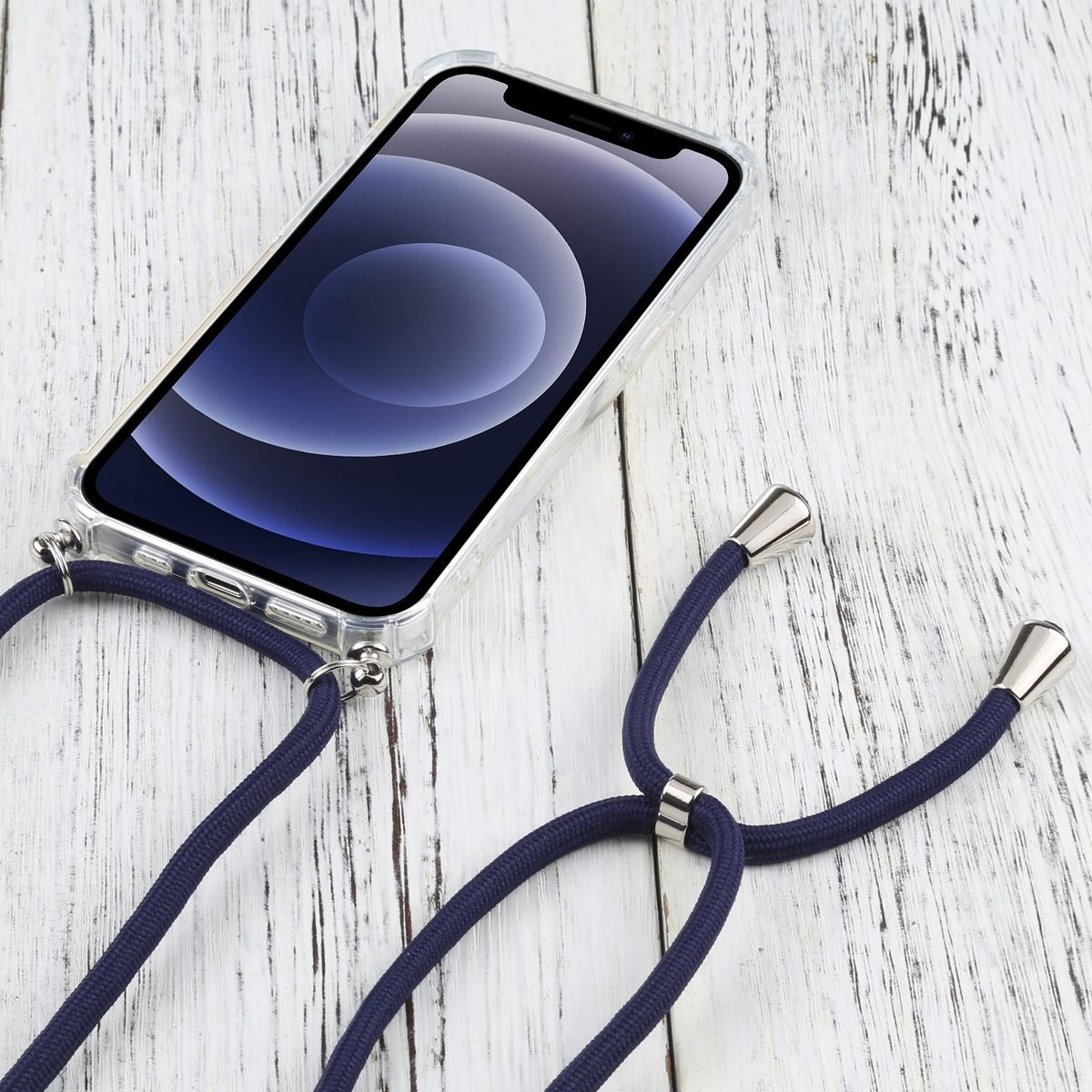 Transparente Handyhülle mit marineblauem Lanyard auf weißer Holzoberfläche.