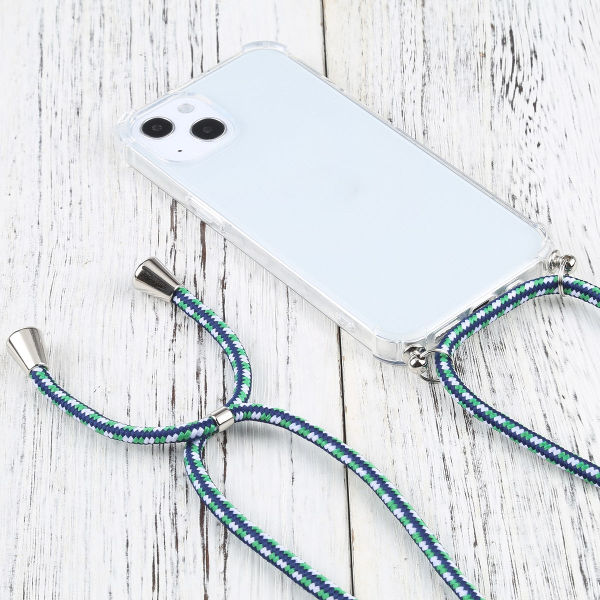 Ein Telefon in einer durchsichtigen Hülle mit einem Lanyard auf einer weißen Holzoberfläche.
