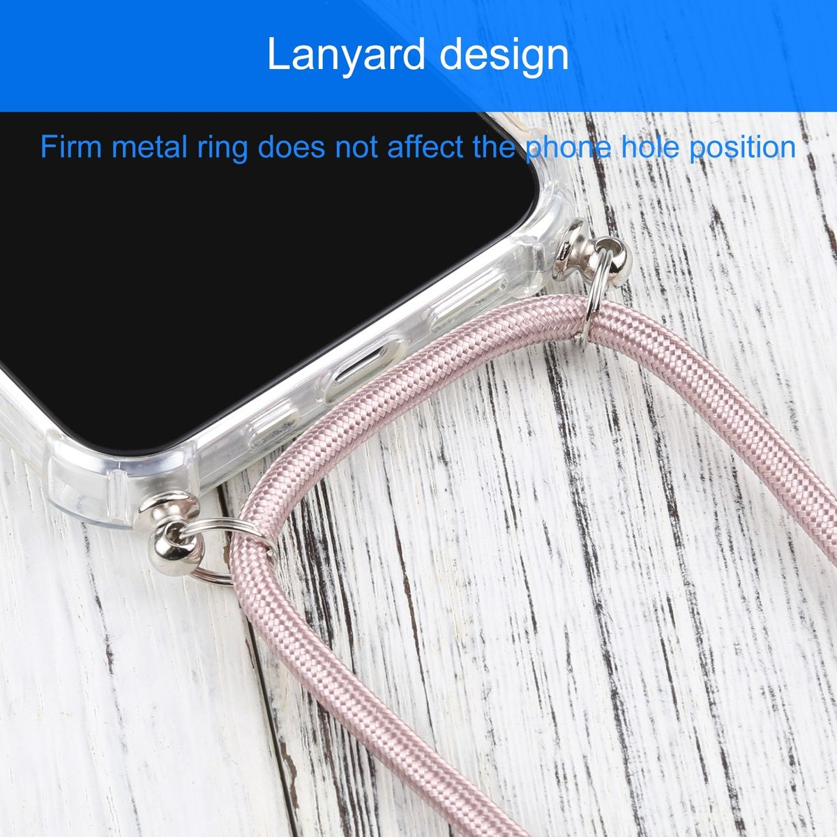 Ein Telefon mit einem pinkfarbenen Schlüsselband, das an einer durchsichtigen Hülle befestigt ist, auf einer Holzoberfläche.