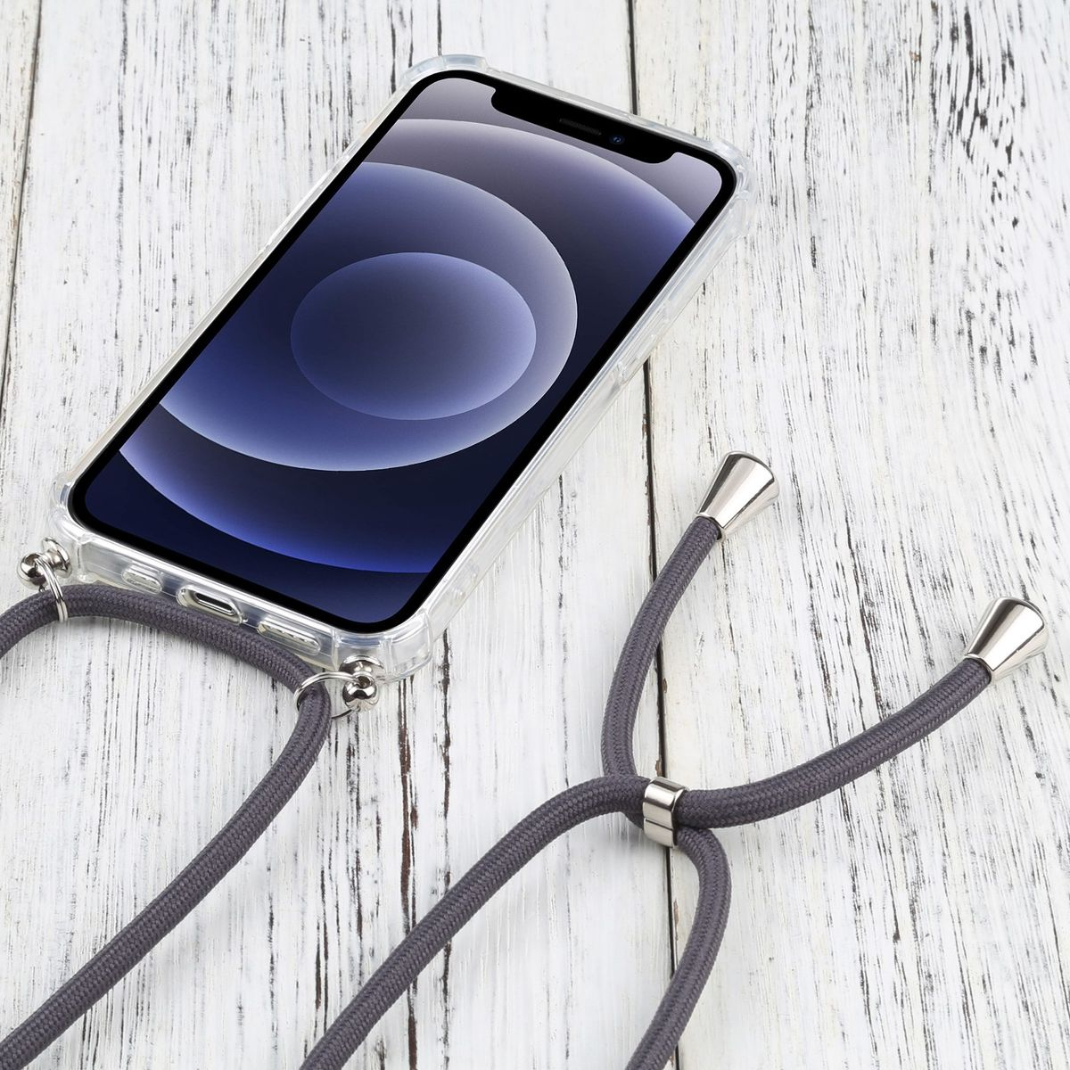 Telefon in transparenter Hülle mit grauem Band mit silbernen Enden.
