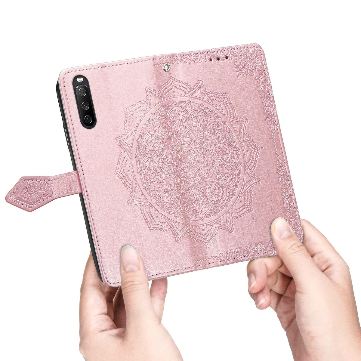 Rosa Handyhülle mit floralem Design. Die Hülle ist geöffnet, zeigt das Telefon und komplizierte Muster.