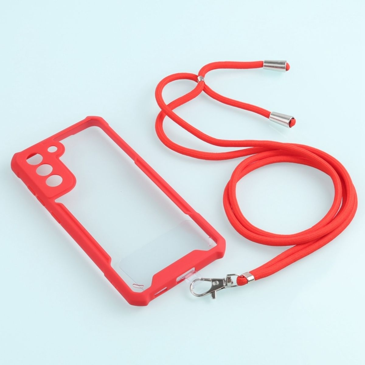 Rote Handyhülle und Lanyard. Die Handyhülle hat eine transparente Rückseite. Das Lanyard ist rot mit silbernen Akzenten.
